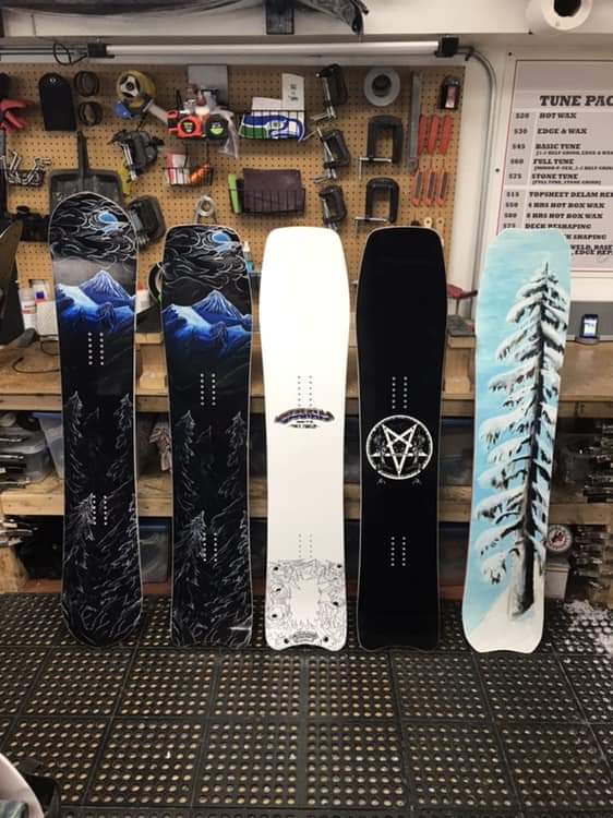 Snowboards Evan has painted in the past.