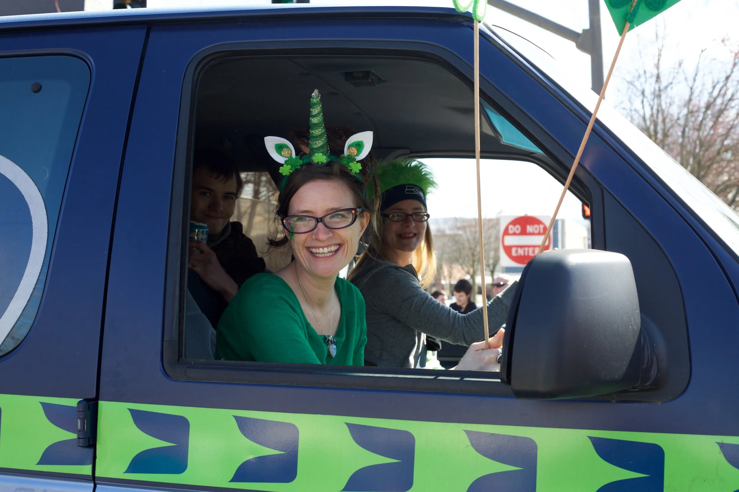 Ashlie riding with coworker, Shelly in the 12th Man Van for the Bellingham St. Patrick’s Day Parade.