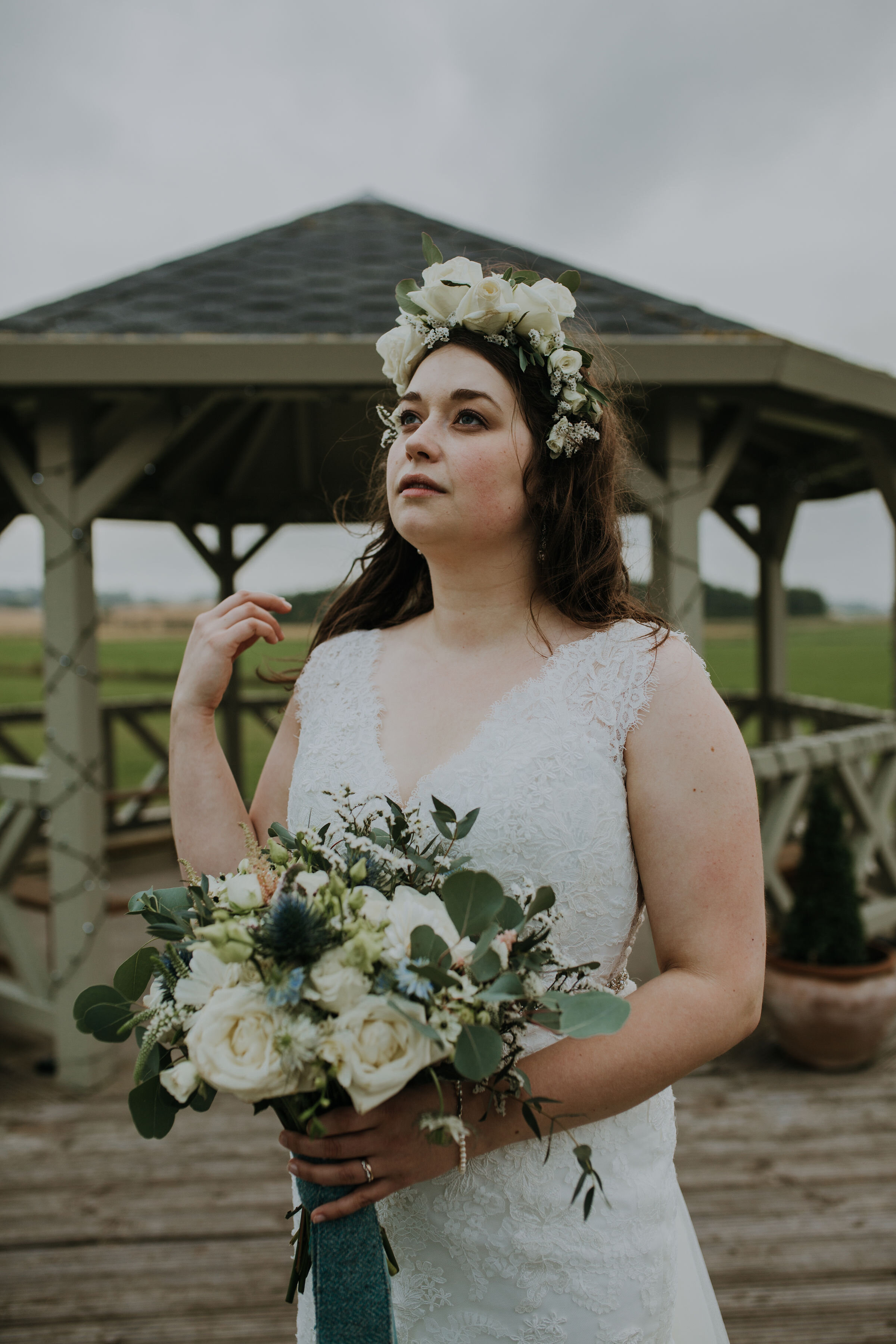 Scottish bride wearing a floral crown and holding Eucalyptus wedding bouquet at Bachilton Barn