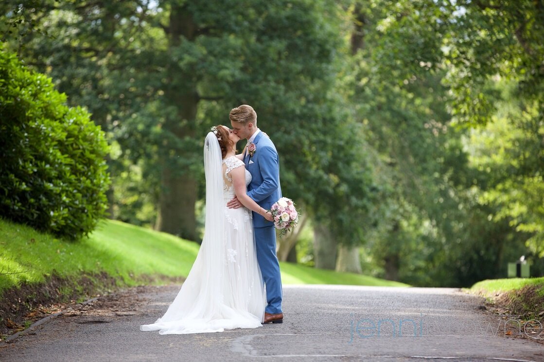 Bride and Groom sharing a kiss in beautiful Perthshire surrounding. 