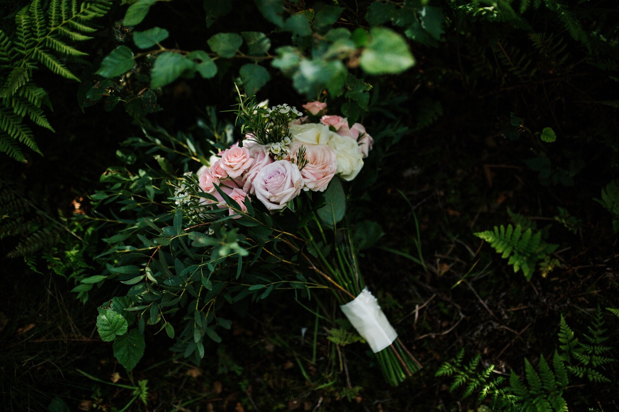 Bridal bouquet lying amongst the foliage at Scottish Wedding