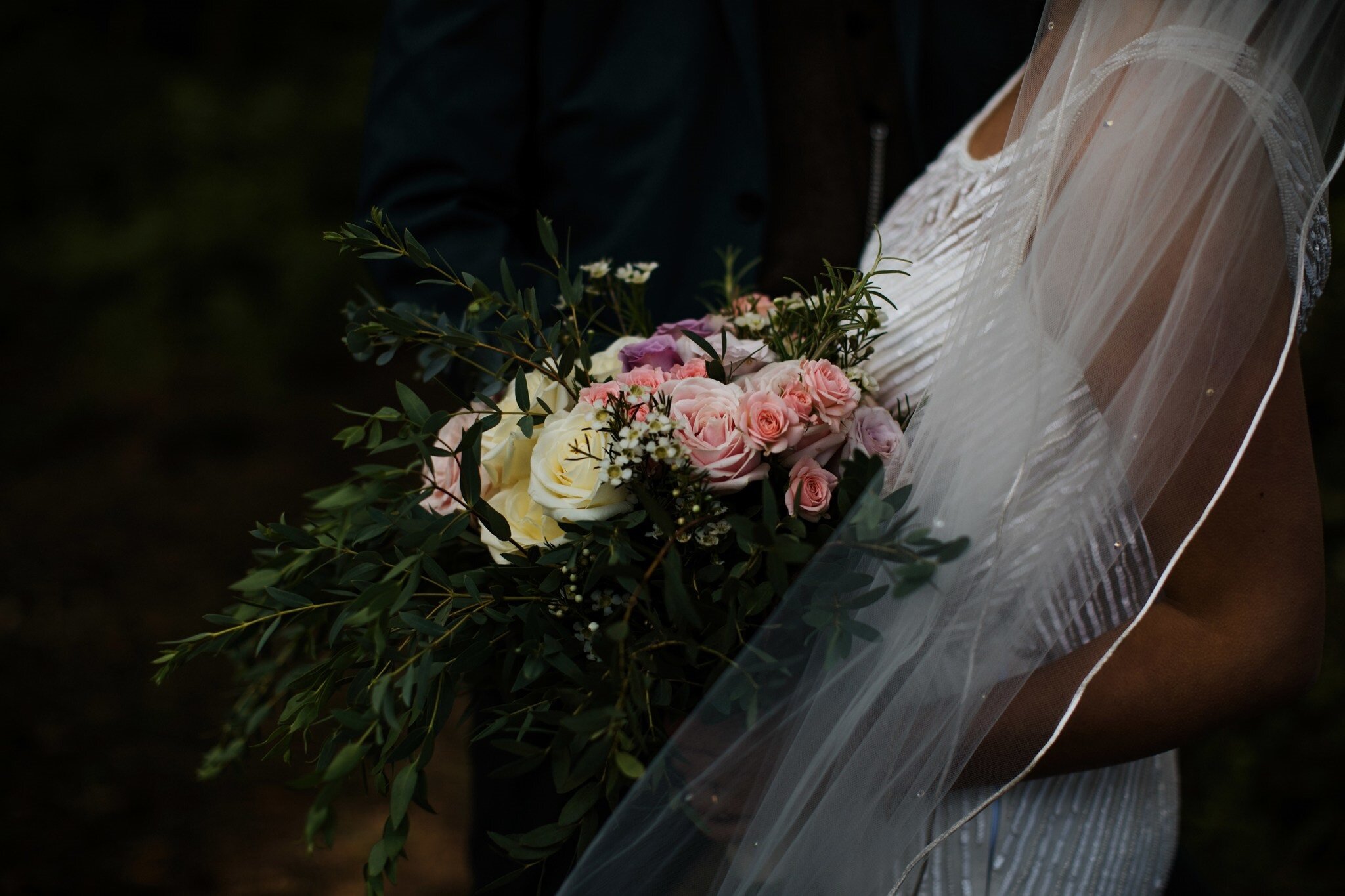 Scottish Bride holding bridal bouquet full of roses and eucalyptus 