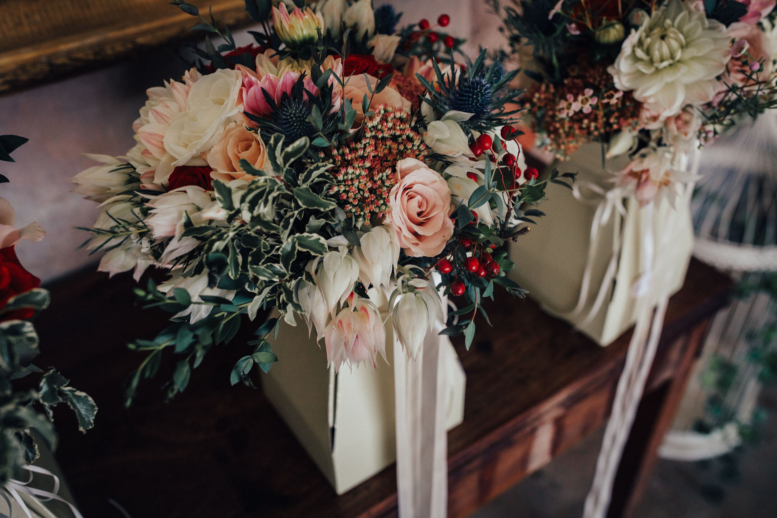 Wedding bouquets tied with pink silk ribbon at Cambo Estate