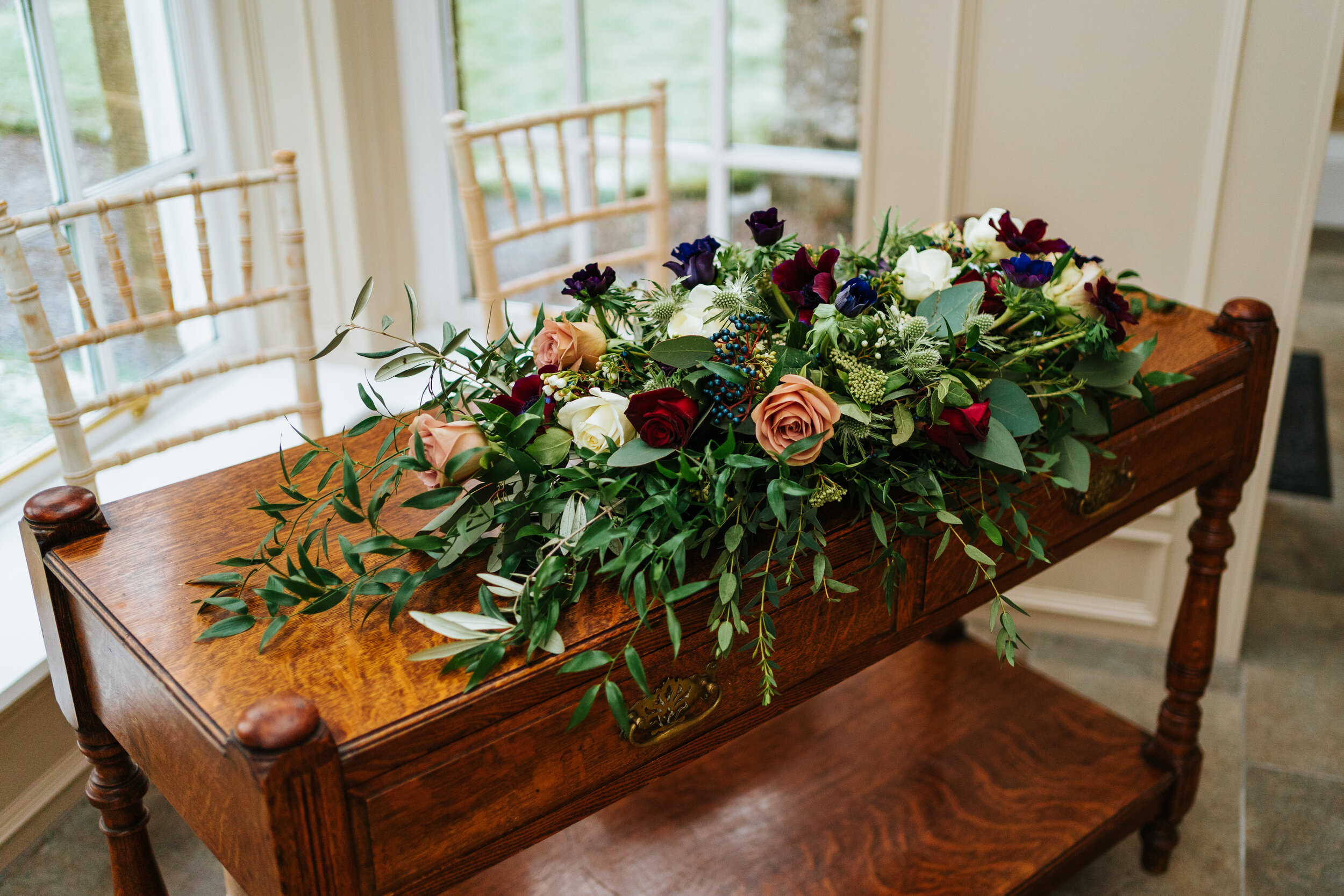 Beautiful wedding flowers decorating ceremony table at Newhall Estate, Scotland