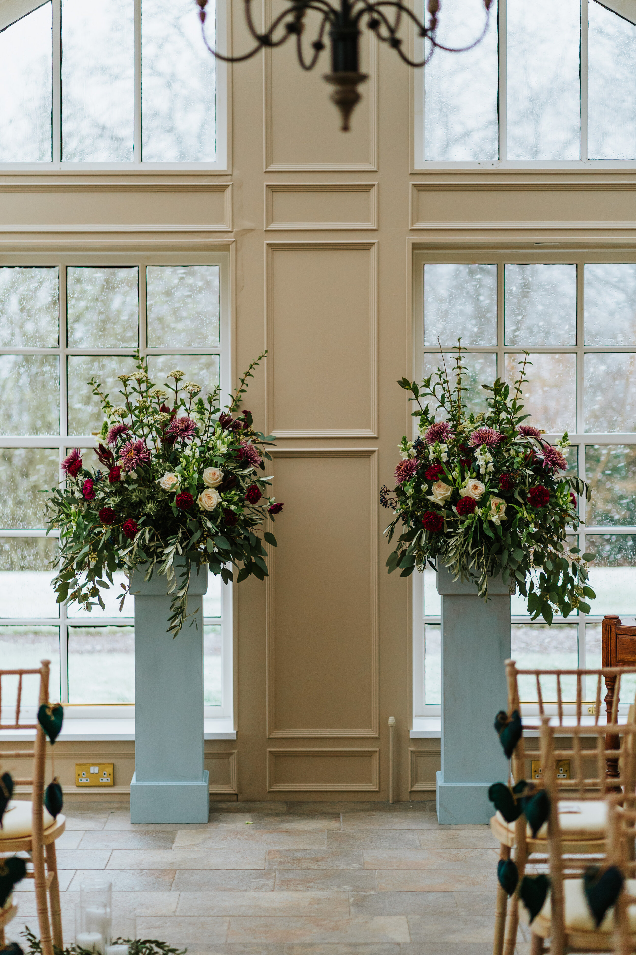 Large floral arrangements used to decorate aisle at Scottish Wedding 