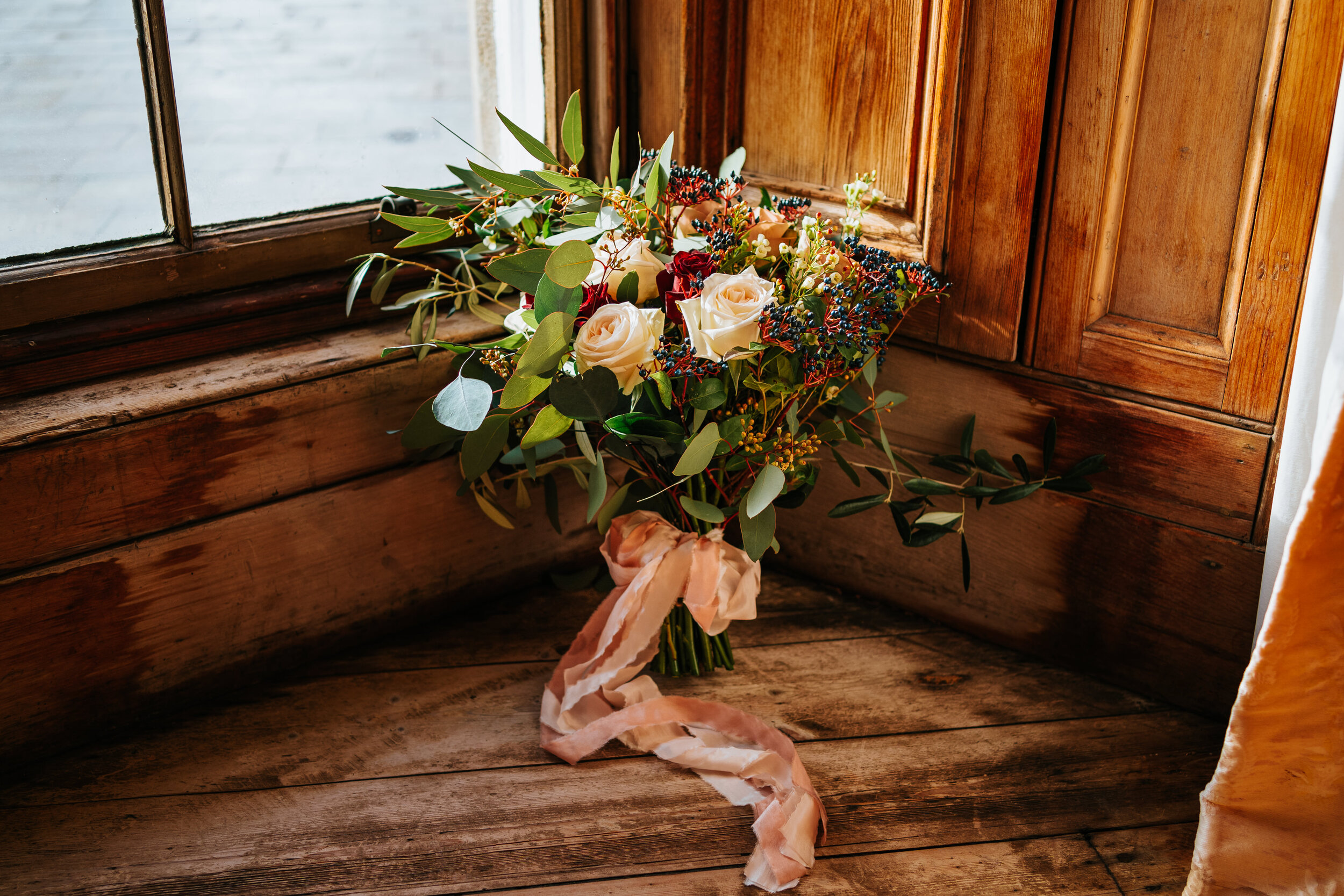 Scottish wedding bouquet by window at Newhall Estate