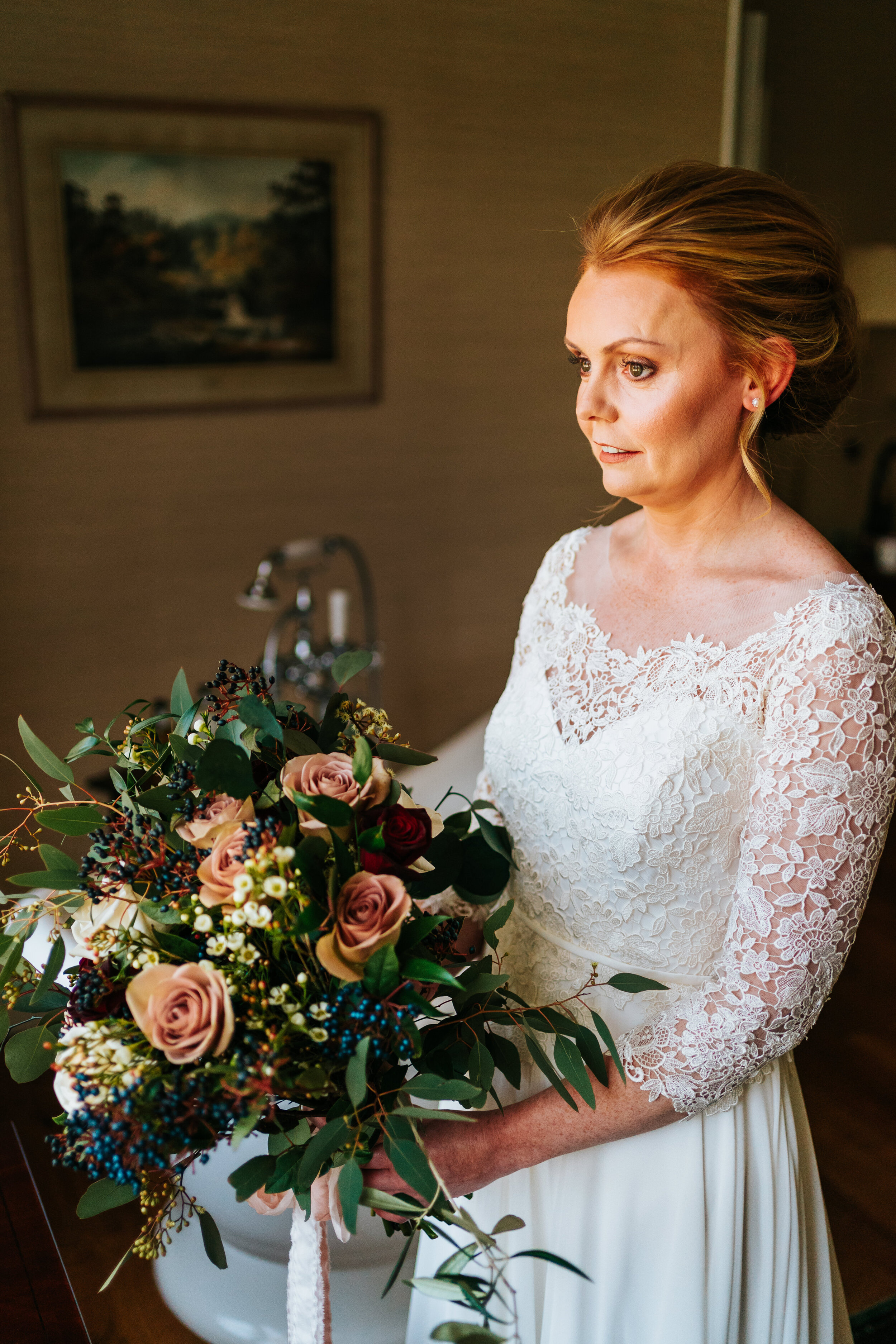 Scottish Bride holding bridal bouquet at Newhall Estate