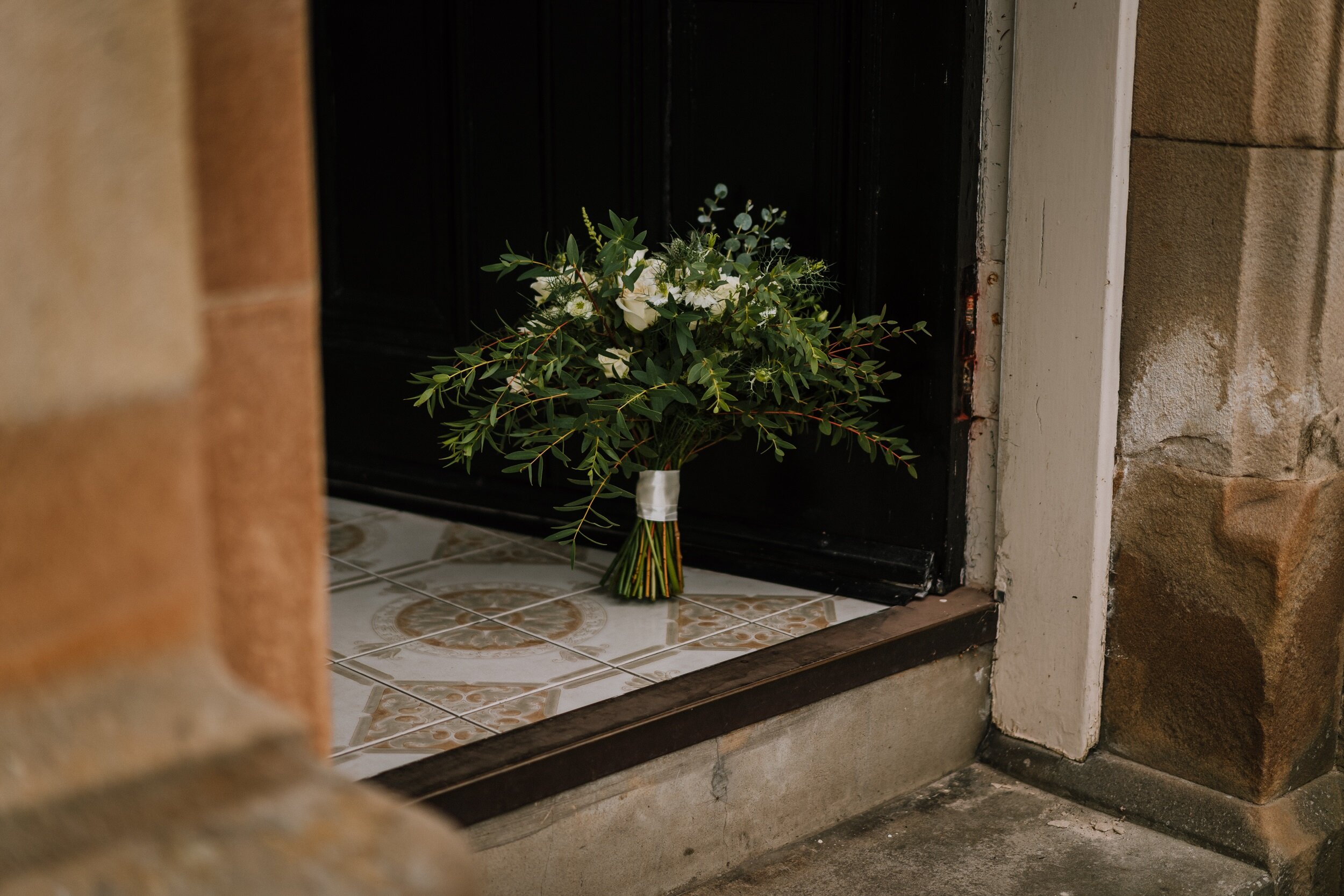 White roses and foliage bridal bouquet at Bachilton Barn 