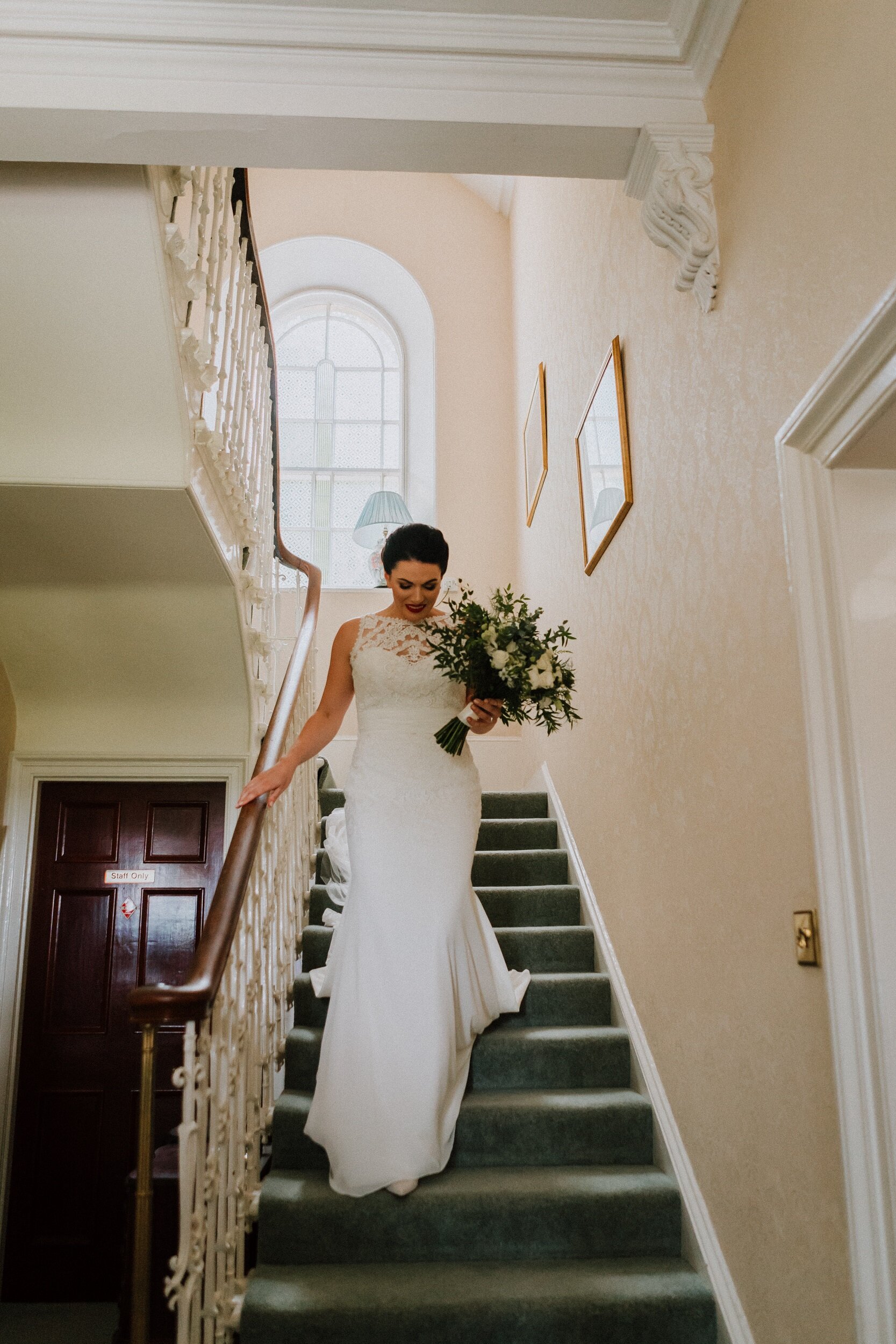 Bride coming down the staircase at Bachilton Barn, Perthshire