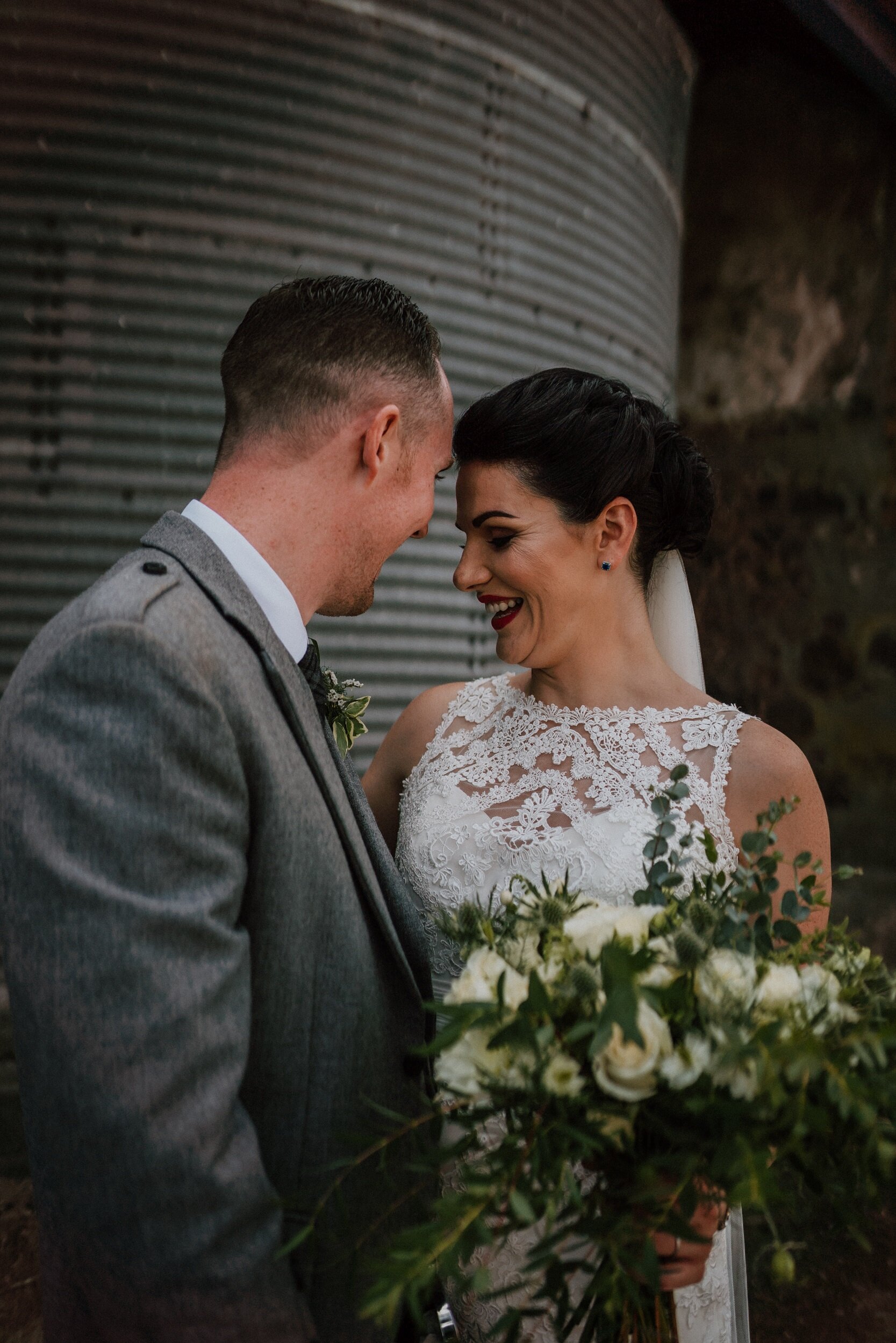 Bride and Groom in an embrace at Bachilton Barn, Scotland