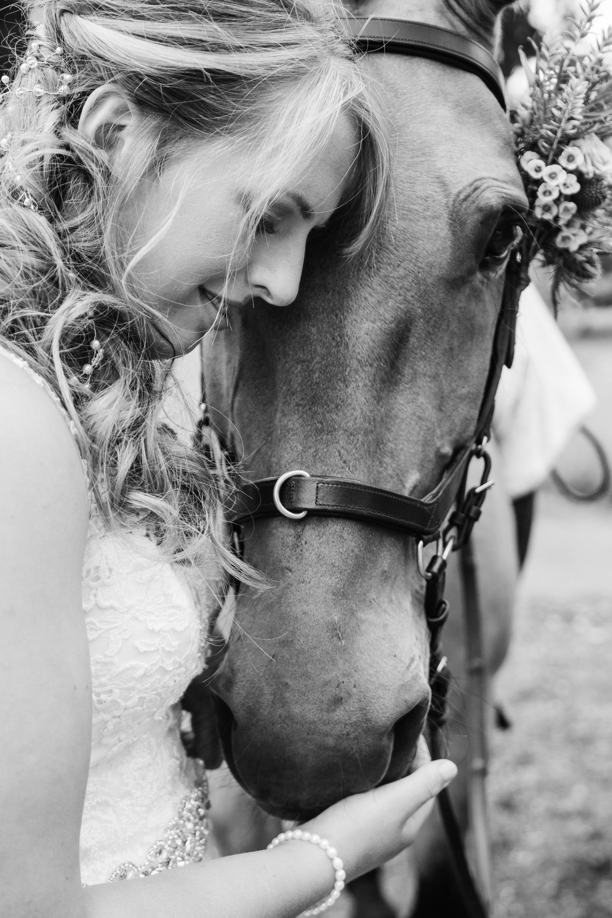 Black and white portrait of Scottish bride and her horse at summer wedding 