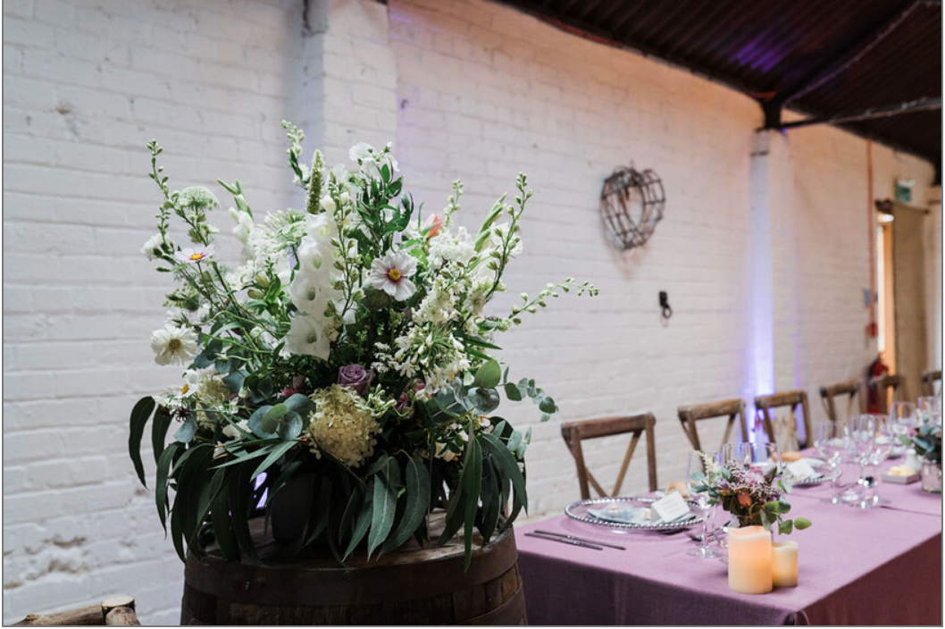 Floral arrangements at rustic scottish barn wedding 