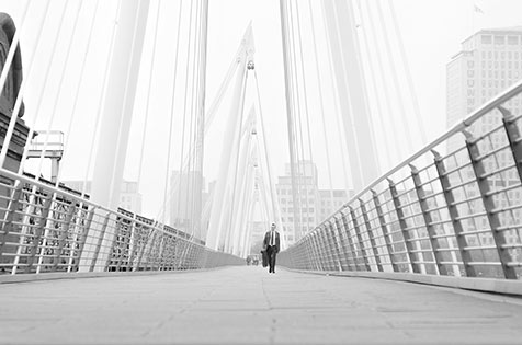 Man-walking-over-bridge-london-iconic.jpg