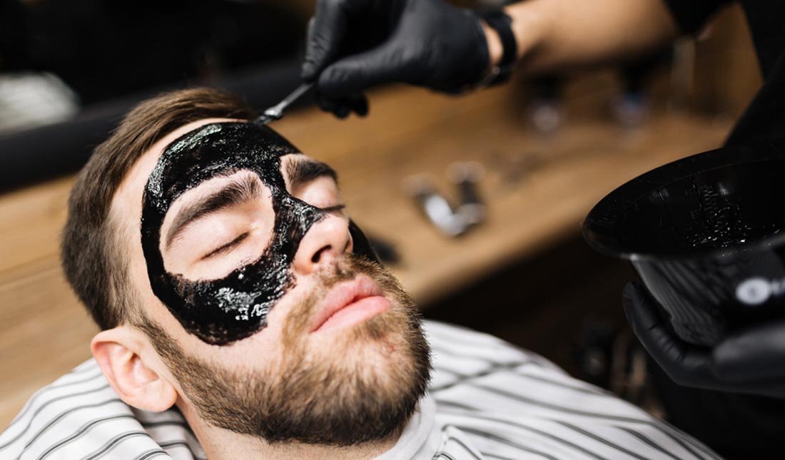 charcoal-mask-applied-to-guys-face.jpg