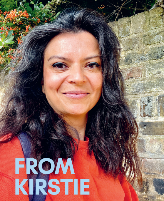 Sonshine Magazine founder Kirstie Beaven, a dual heritage Indian and English woman in her 40s with dark hair smiling