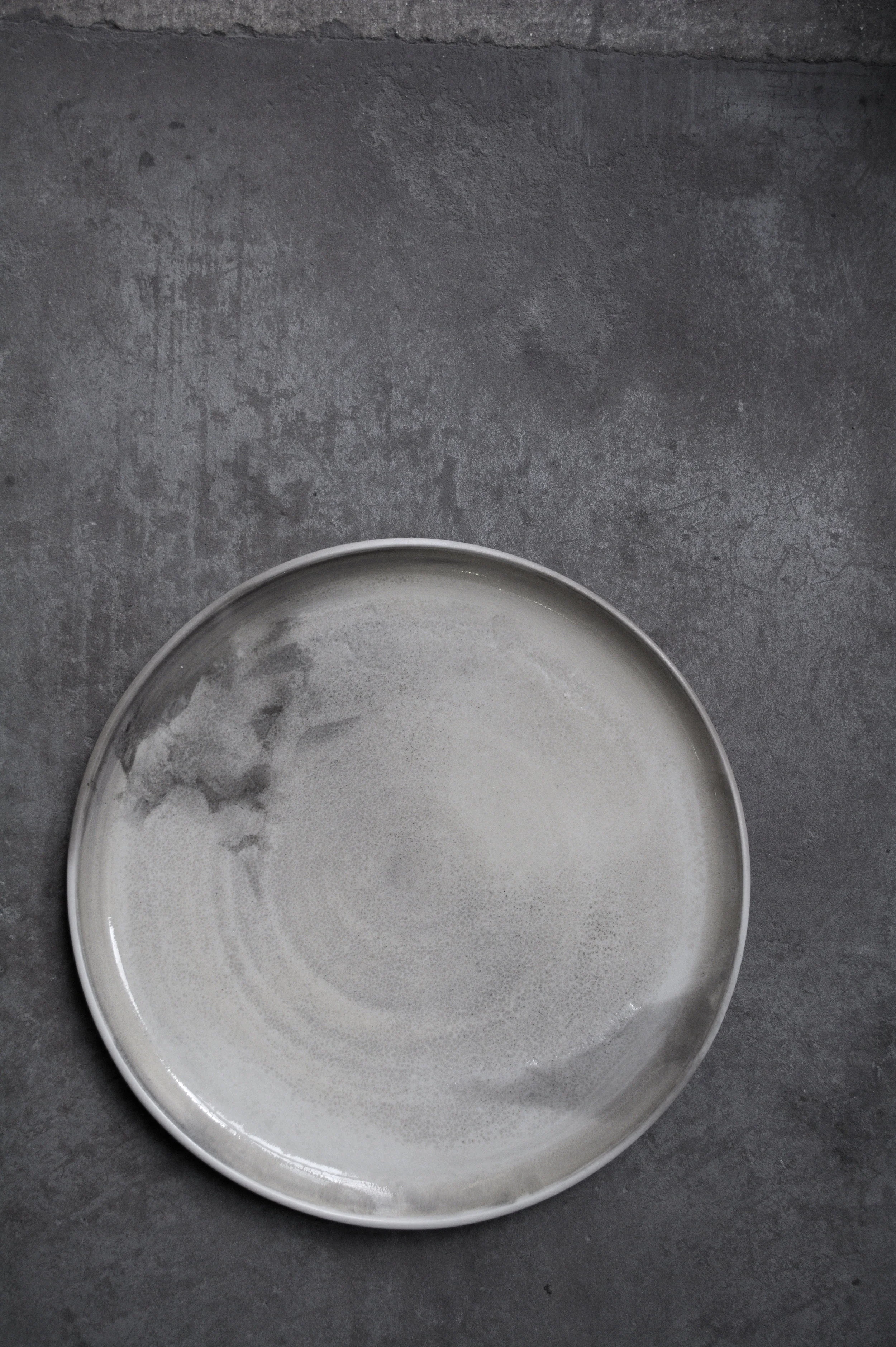 Burnt no. 2, 2018. 1.5x27x27cm Thrown porcelain saggar fired with turf cut with from Dregish bog in County Tyrone.