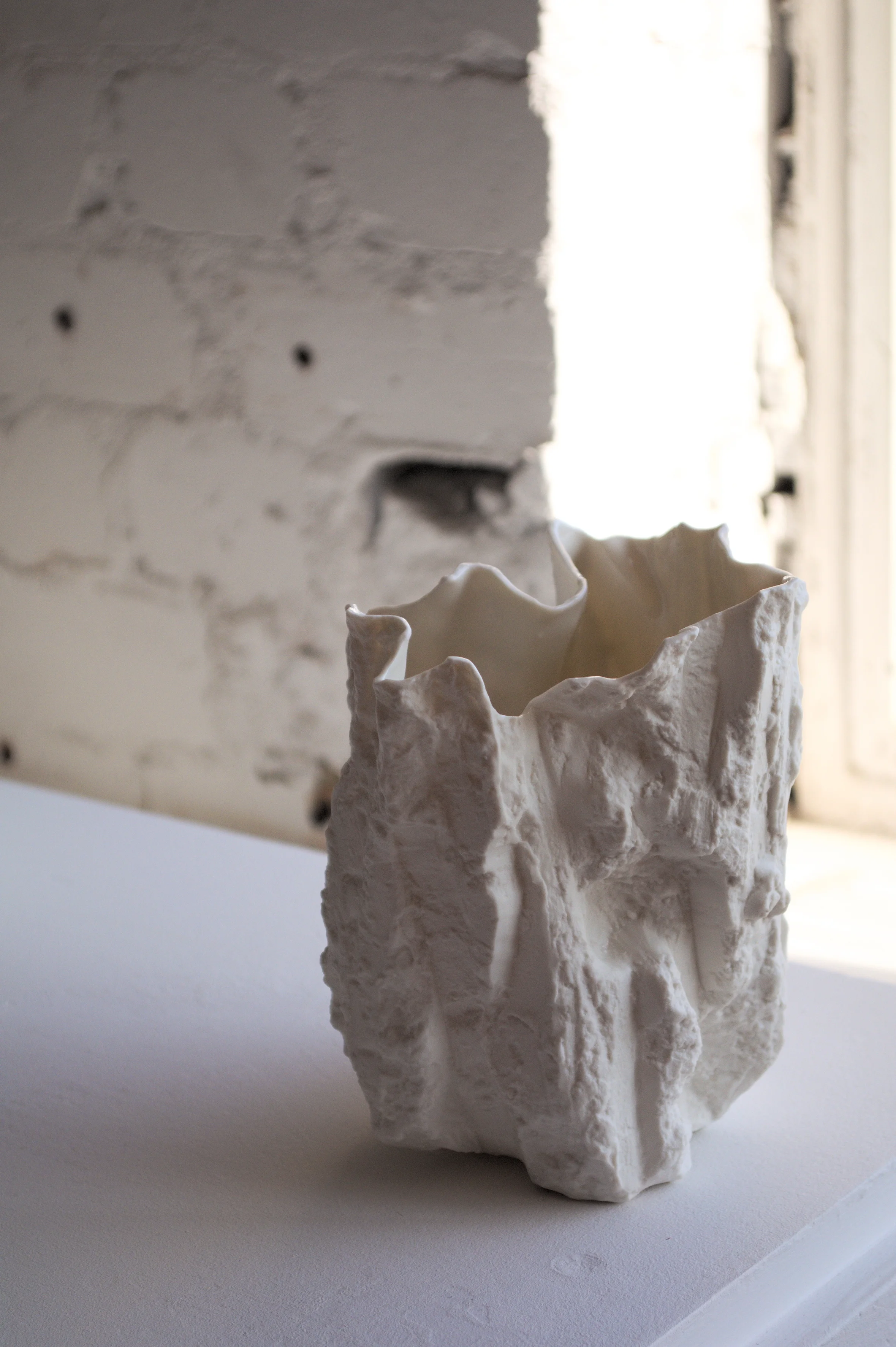 Cut no. 6, 2019. 14.5x12x10cm. Slip cast porcelain, edition of 15.