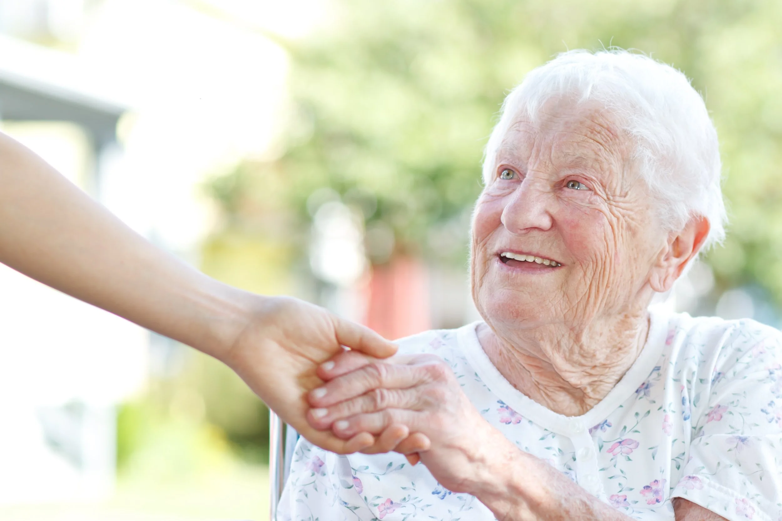 Lady holding hand with helper.jpg