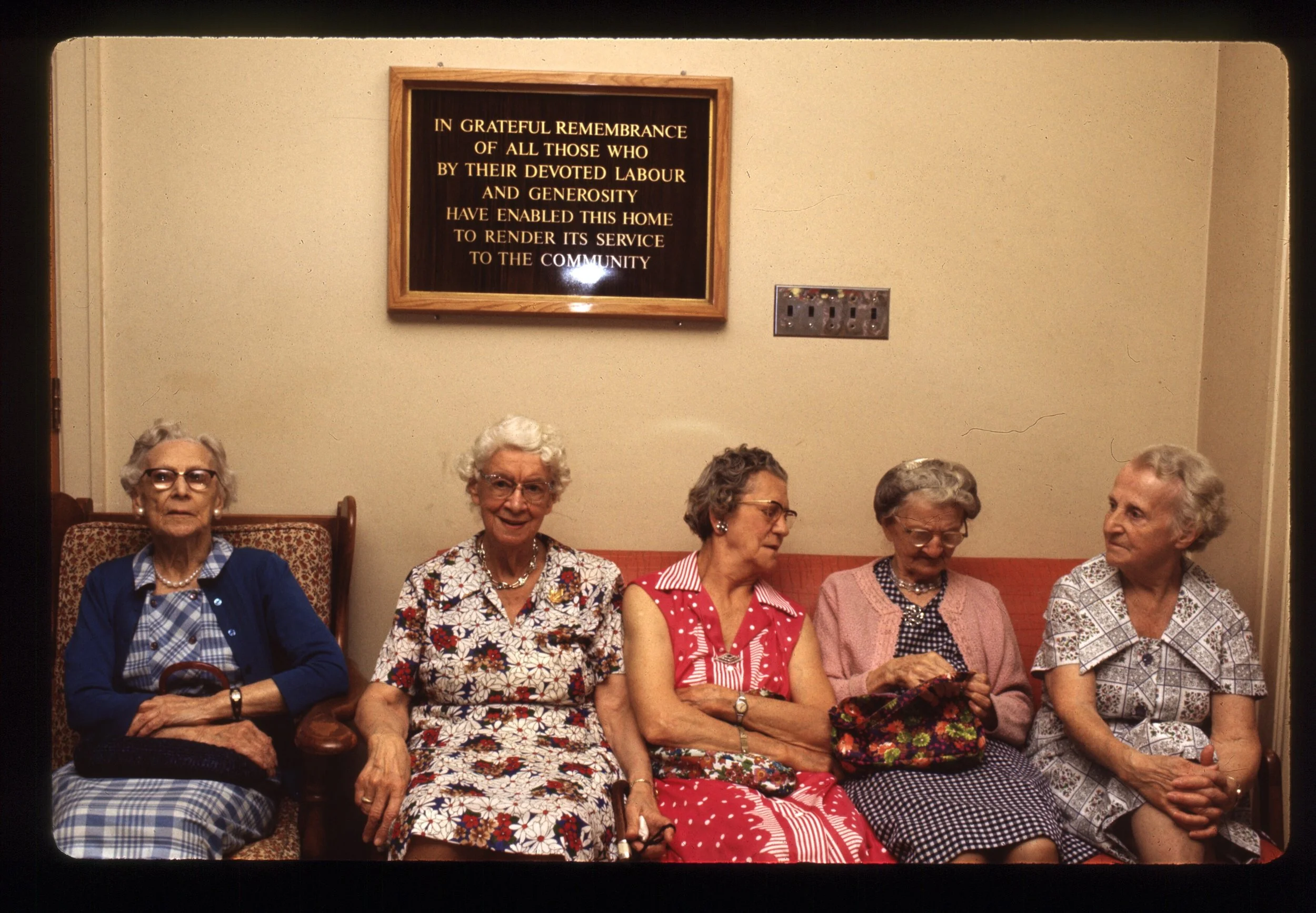 Ladies on Couch under sign.jpg