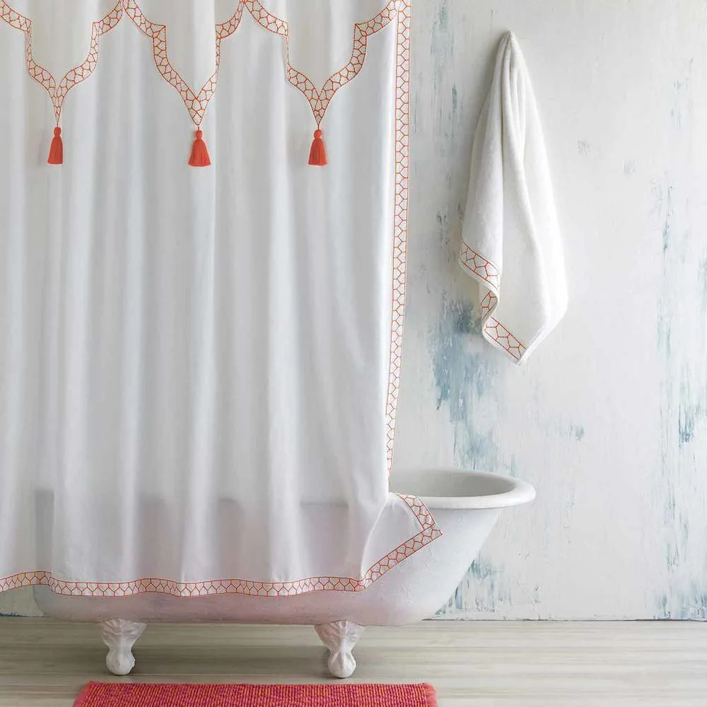 Orange accent shower curtain with orange rug