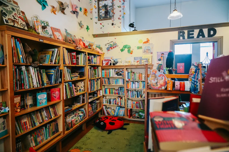 Out West Books This cozy bookstore feels like a well-loved home. The children’s corner is complete with a table, chairs, and a soft ladybug where kids can snuggle up with a book from the expertly curated selection. Children enjoy story time every Wednesday at 10:30am. 533 Main St. • outwestbooks.co