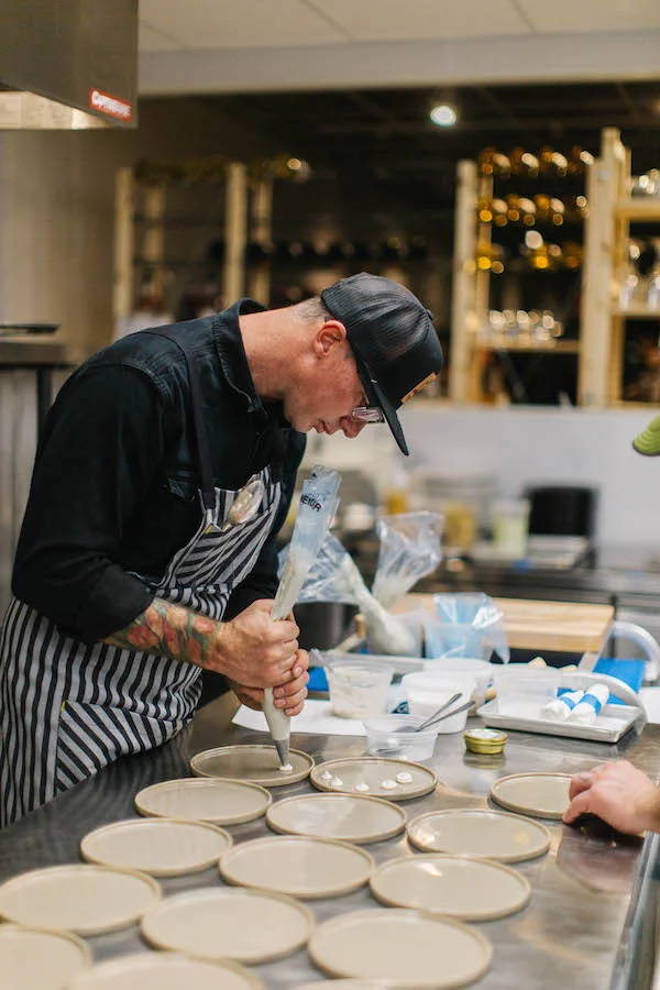 Chef Josh Neirnberg prepares a custom menu for a private event at Dinnerparty in downtown Grand Junction / Owner of Bin 707 Foodbar, Tacoparty, and Dinnerparty in Grand Junction / Visit Grand Junction board member 