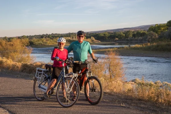 “Our e-bikes get us excited about going for long rides and bicycling up hills. It’s great exercise. We have biked up to Maroon Bells, on many Grand Junction trails, and to and from church. The possibilities are endless! Many of our friends are graduating to e-bikes.” — David Mayer and Lynette Richardson biking along the Riverfront Trail in Grand Junction