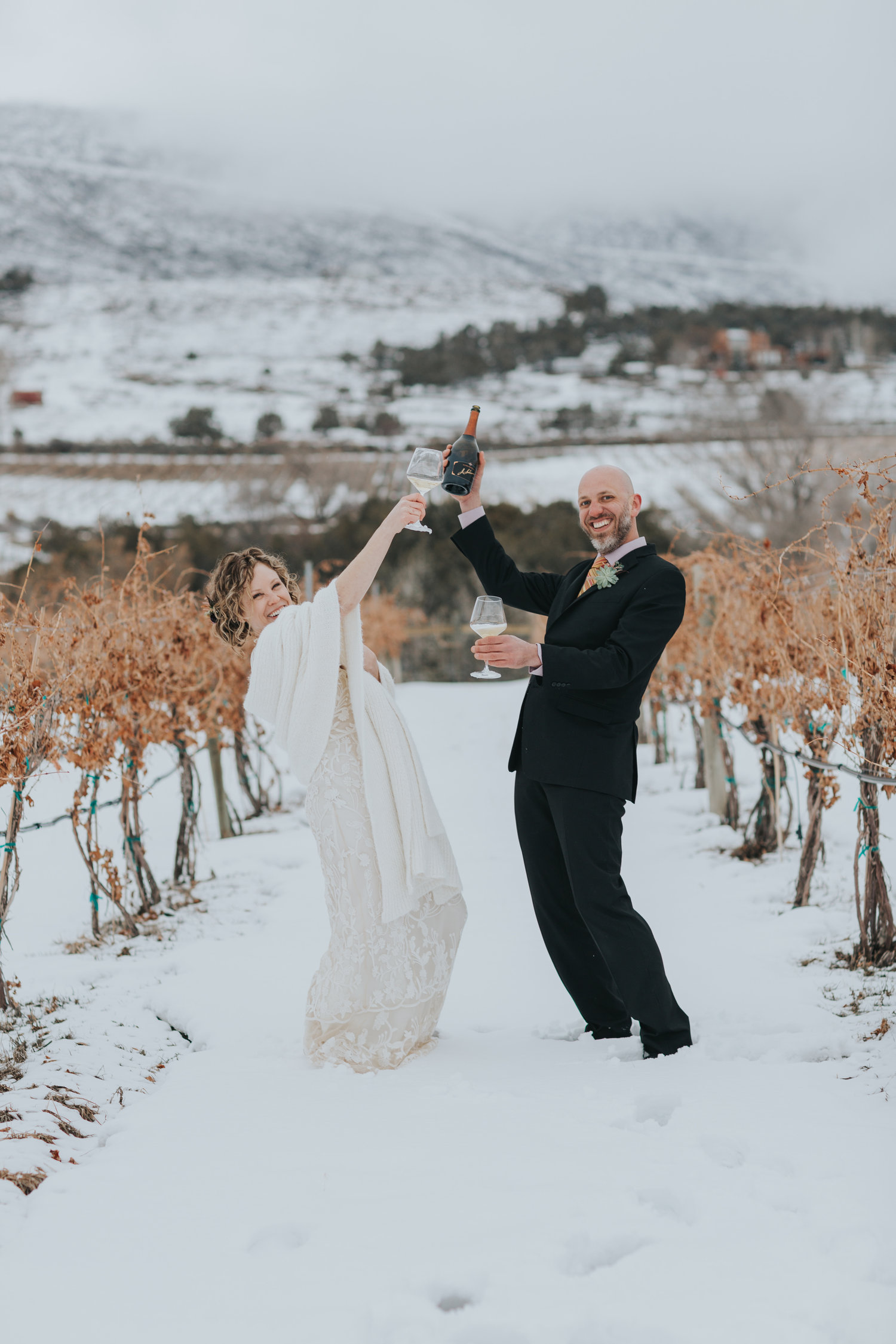 Jayme and Steve toast their marriage during a private ceremony (just the two of them) amongst the dormant Chardonnay vines, February 2019. OLIVIA EMMER / OLIVE & WEST PHOTOGRAPHY