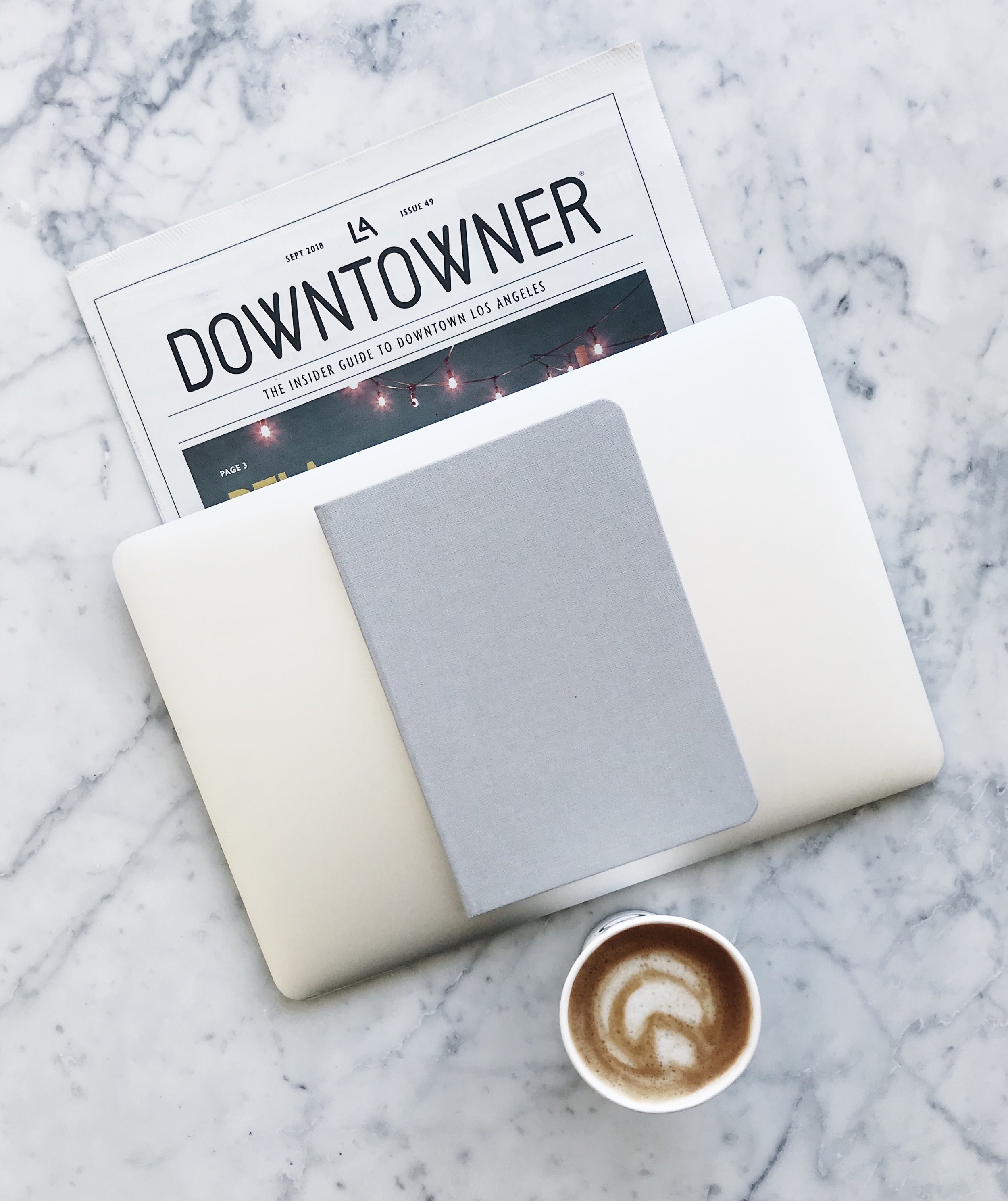Laptop: Apple / Newspaper: LA Downtowner / Journal: Baron Fig / Coffee: Eightfold Coffee