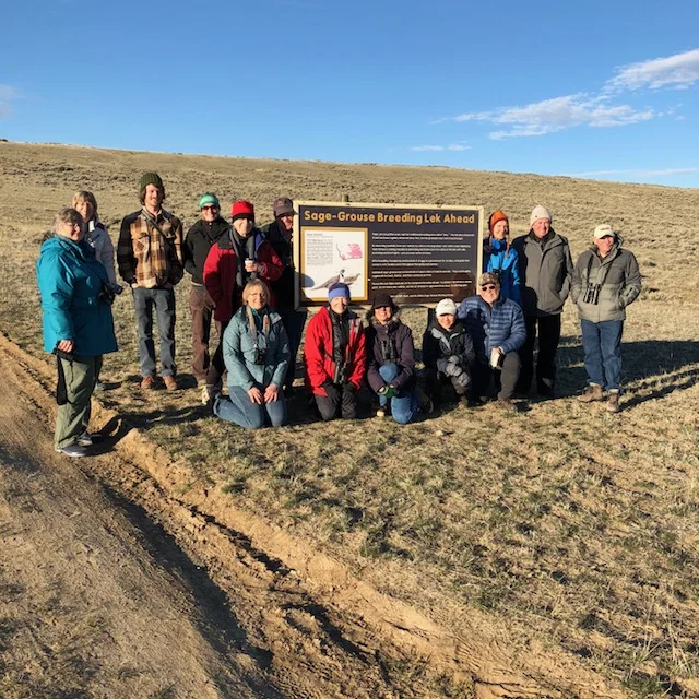 happy crowd after watching sage grouse
