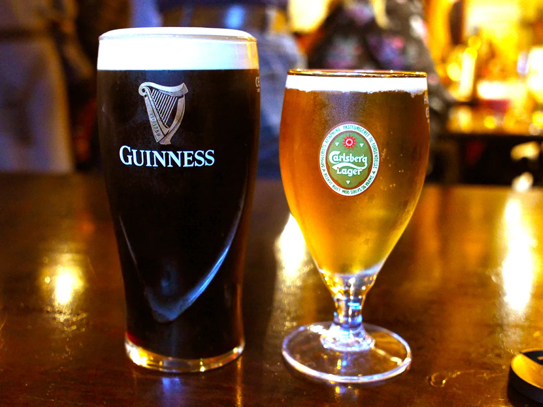 Pints of Guinness and Carlsberg at The Spaniard 