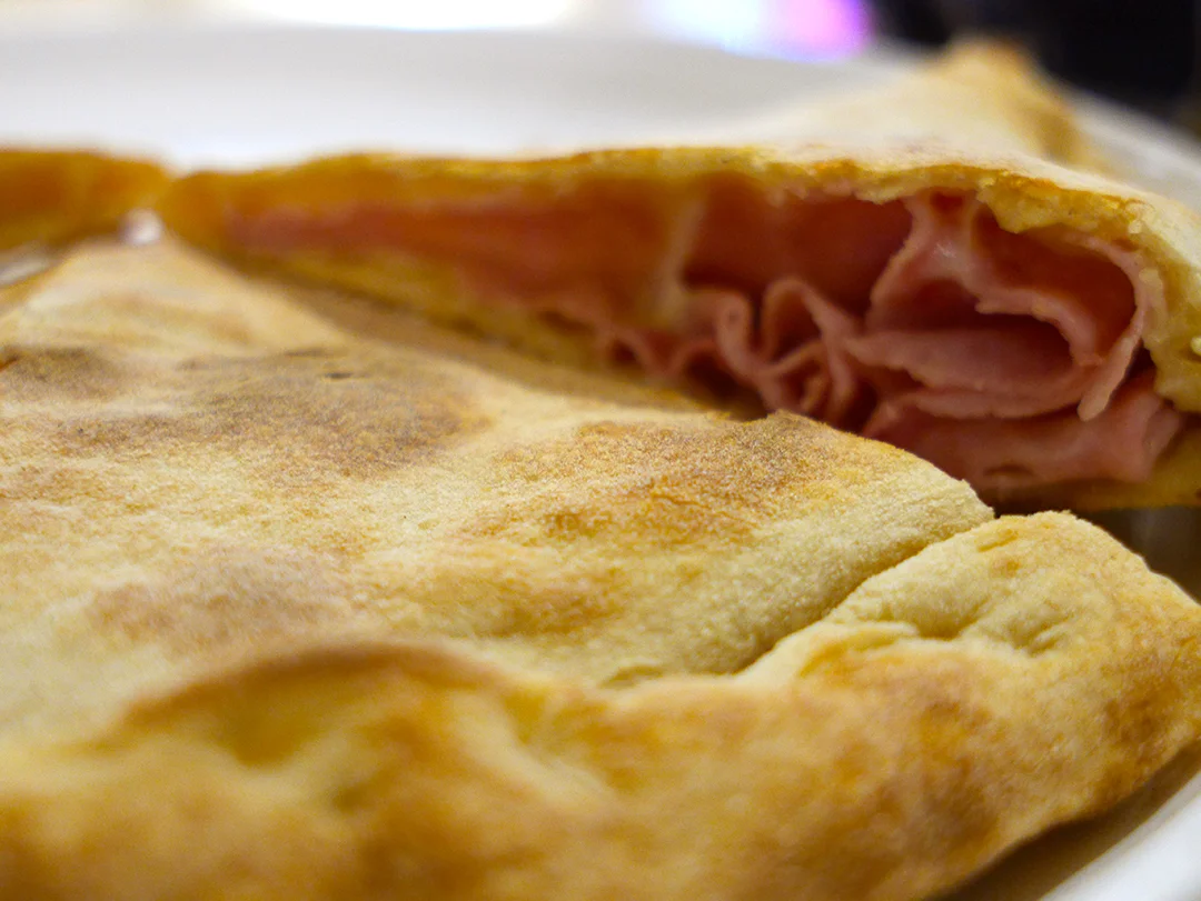 Ham and cheese calzone at La Prezzemolina in Rome, Italy
