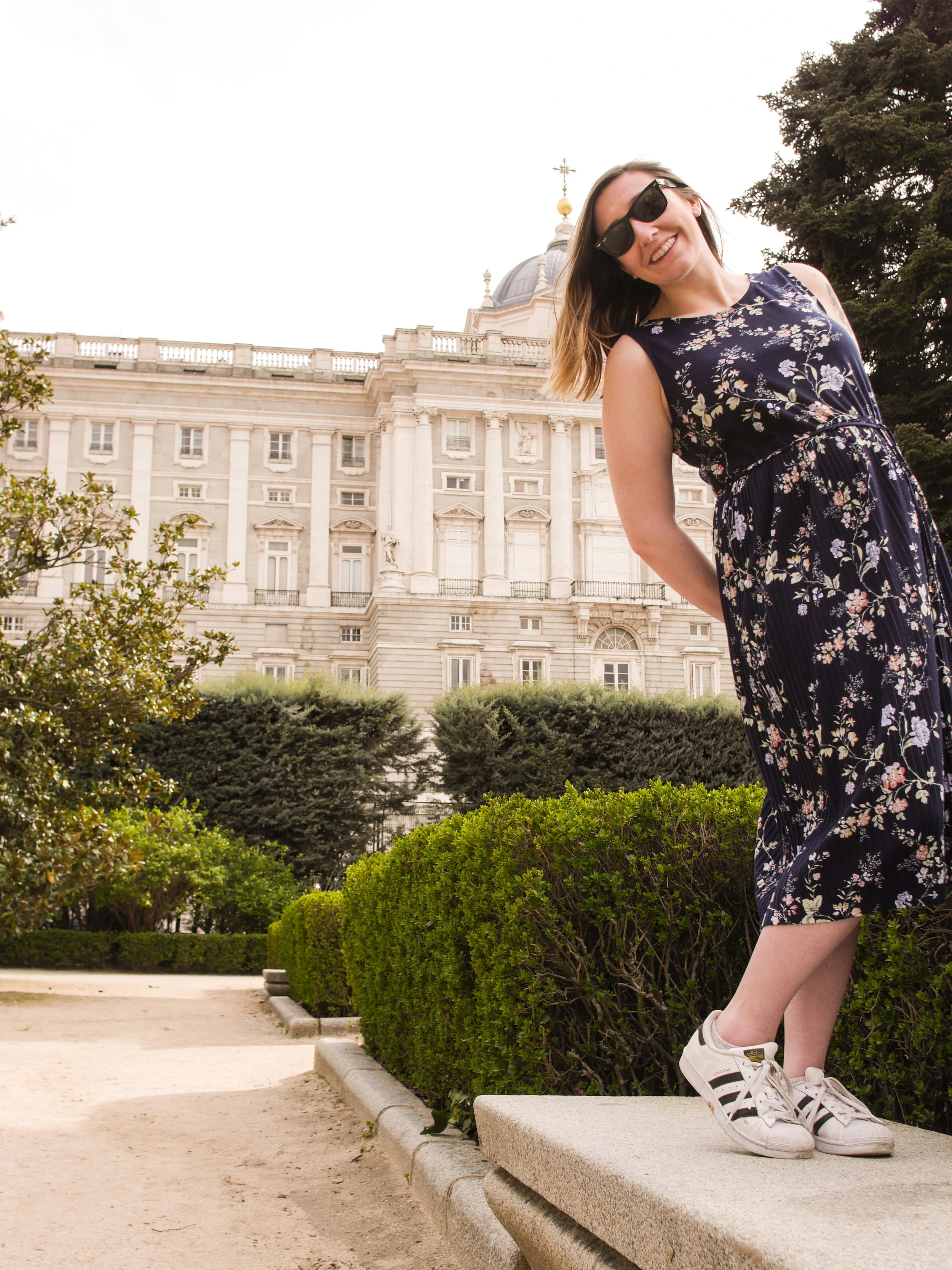 Candid Alexandra in front of the Royal Palace of Madrid in Madrid, Spain