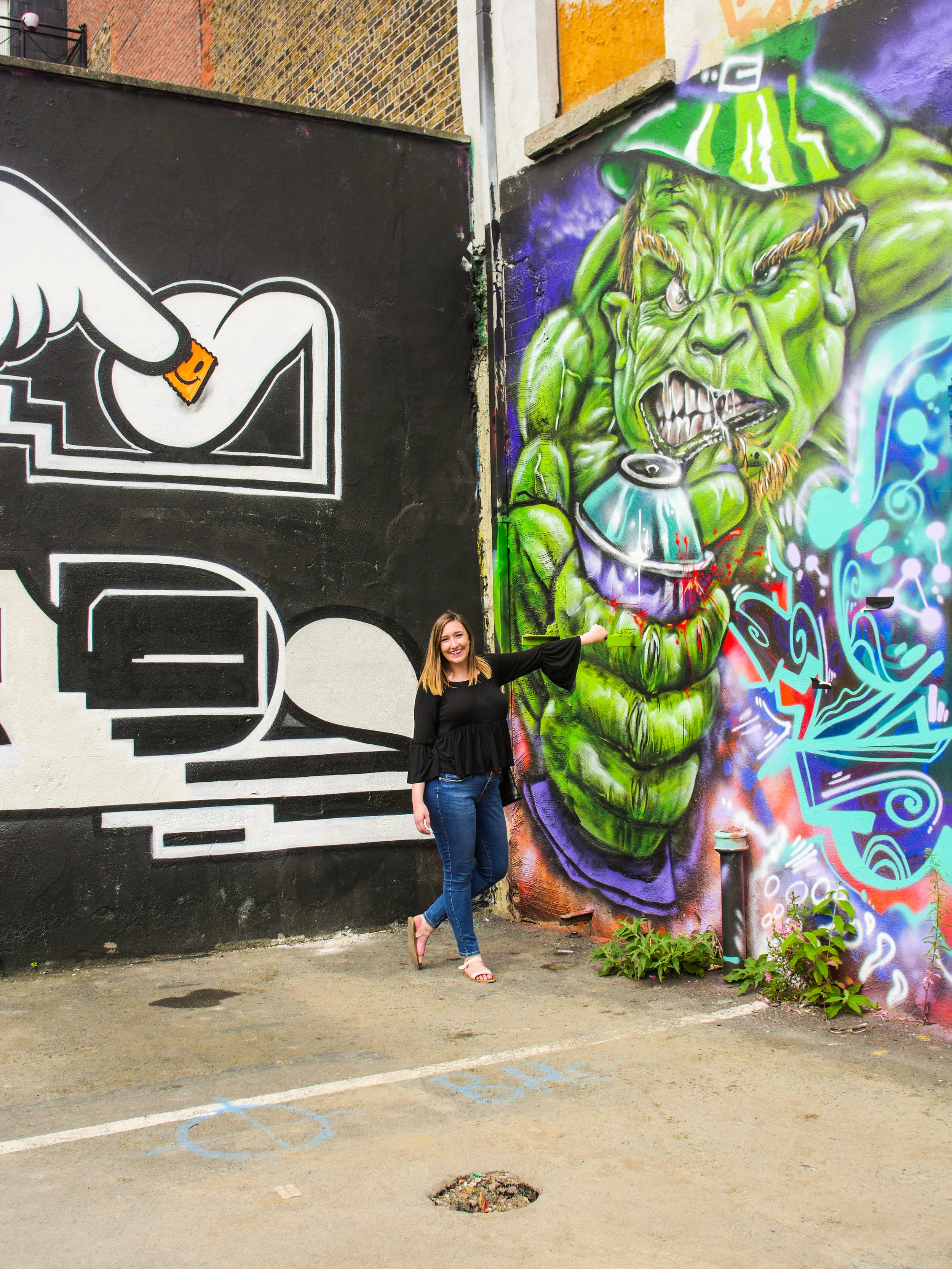 Candid Alexandra with street art at Tivoli Theatre in Dublin, Ireland