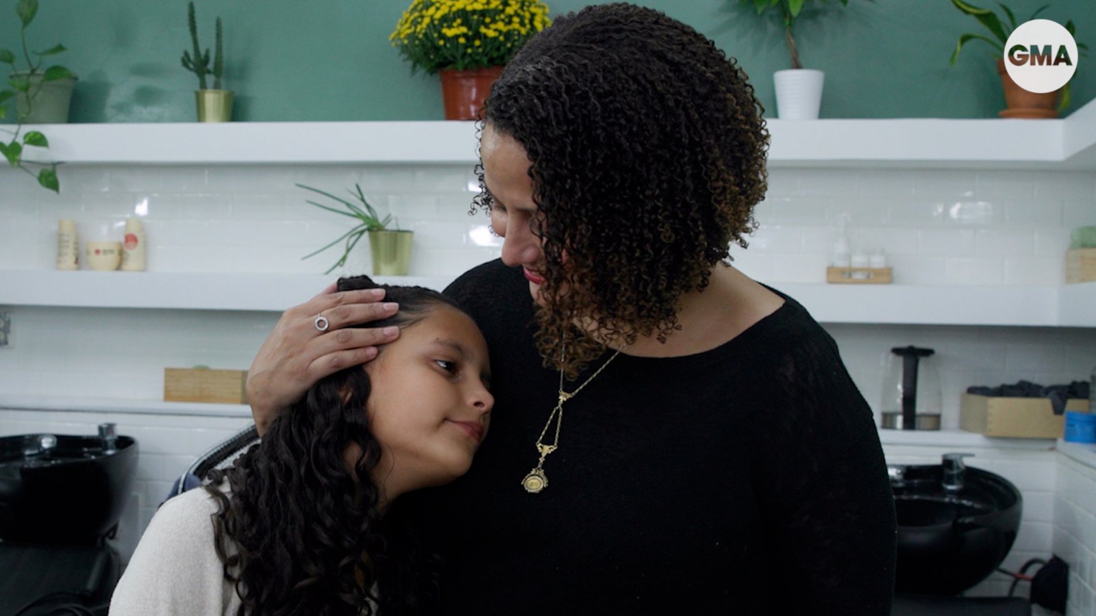 Mother and daughter talk beauty of natural hair while at salon