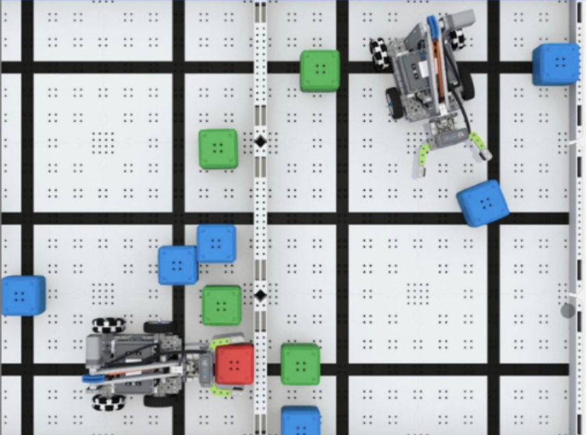 Two small robots navigating a colored grid during a K–5 STEM summer camp activity