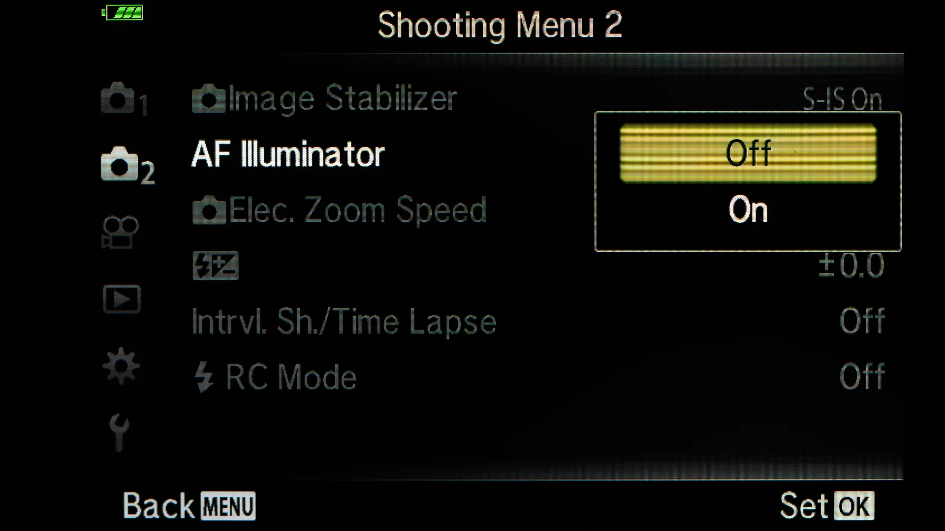 Turn off the AF Illuminator. If photographing a lot in dark, them this option is good to be on. It will help to focus.
