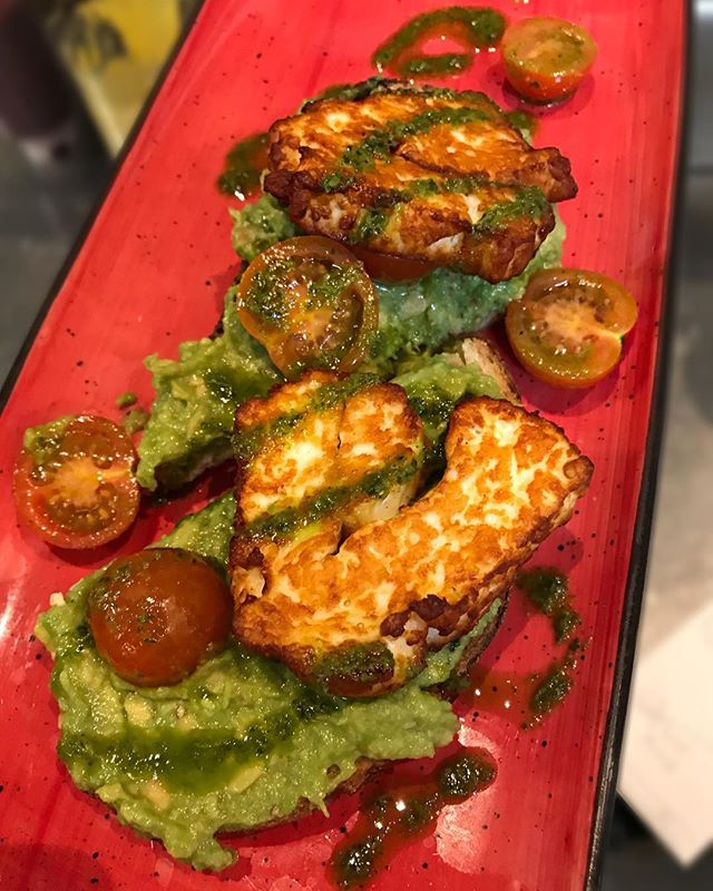 Avo &amp; Co, Smashed Avocado, Grilled Haloumi, Cherry Tomatoes, Salsa Verde on Sourdough Toast. Vegetarian option served Mon-Fri for breakfast #joesandbros #vegetarian #foodforall