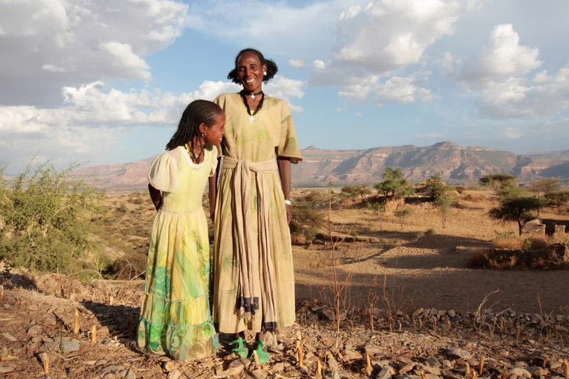 Medhin Reda and her daughter in the village of Adi Ha, Ethiopia. Medhin is a participant in the R4 weather insurance program. (Photo: Coco McCabe / Oxfam)