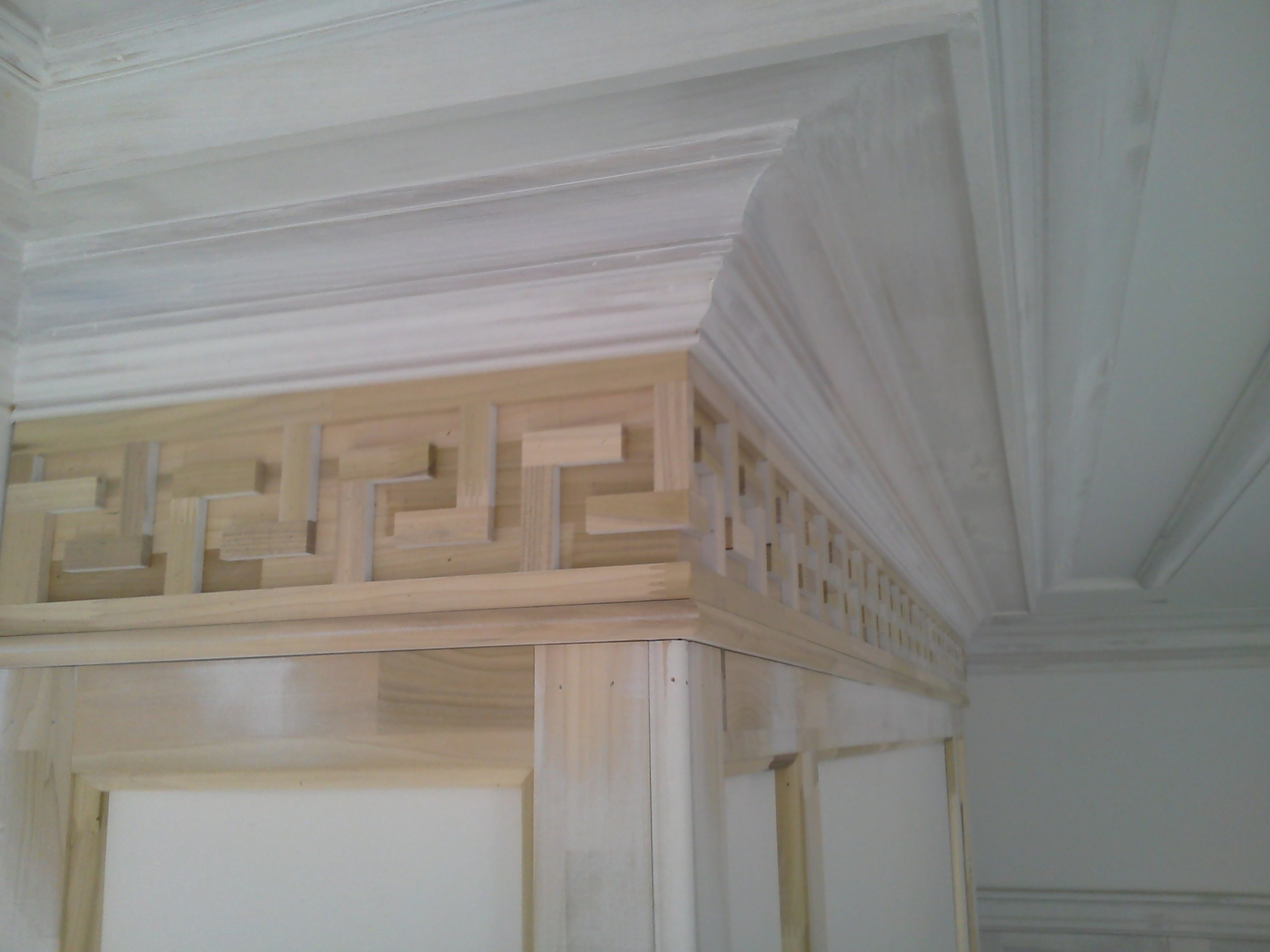 Closeup view of Greek Key Fireplace Surround