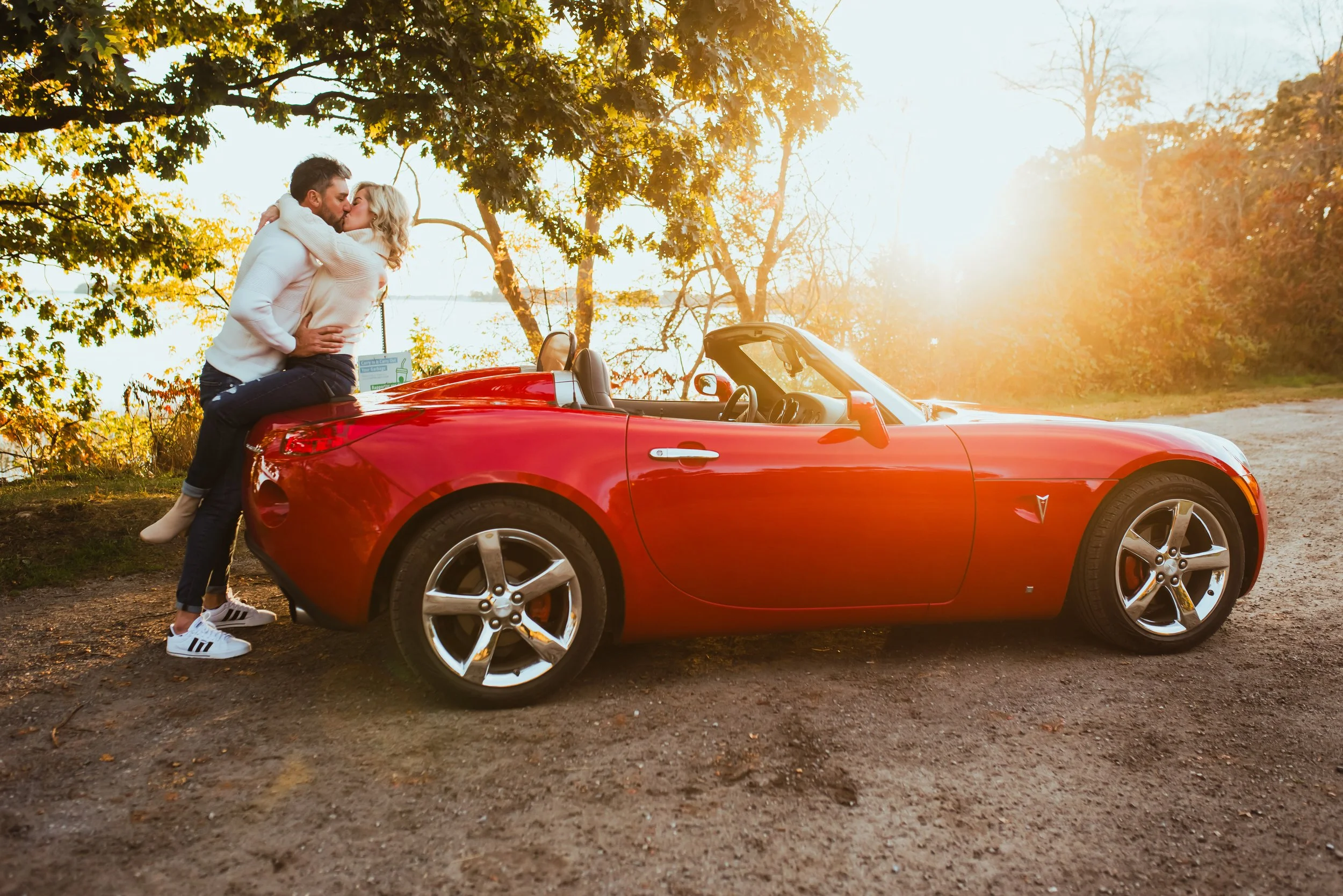 Dreamy engagement session sports car St. Lawrence River Landon's Bay Brockville, ON