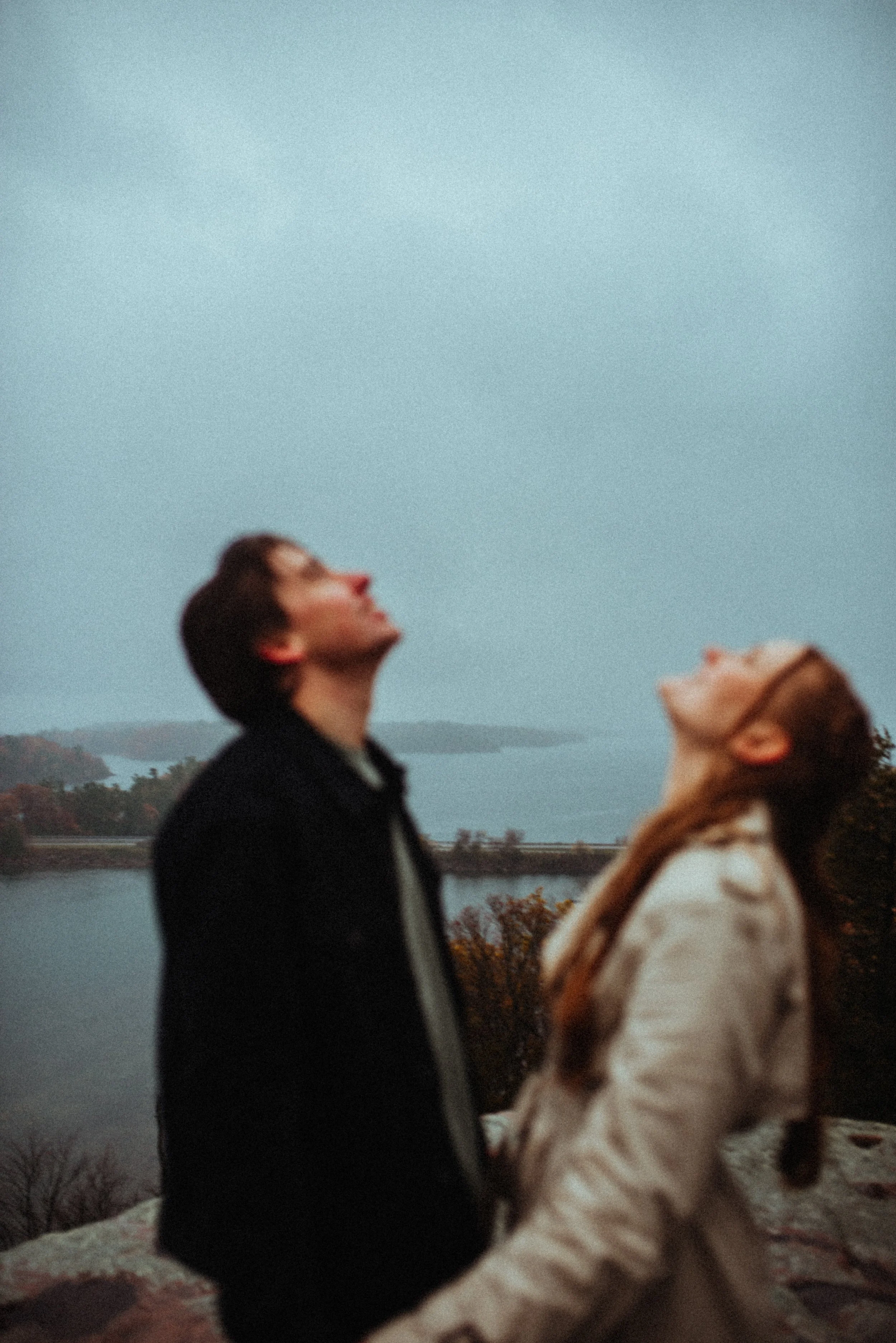 Rainy romantic engagement session clifftop St. Lawrence River Landon's Bay Brockville, ON