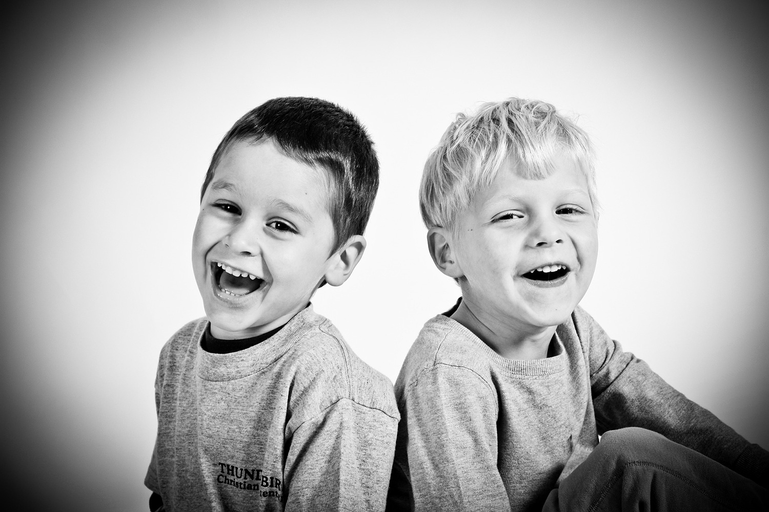 Two young boys with healthy teeth - safe toothpaste for children