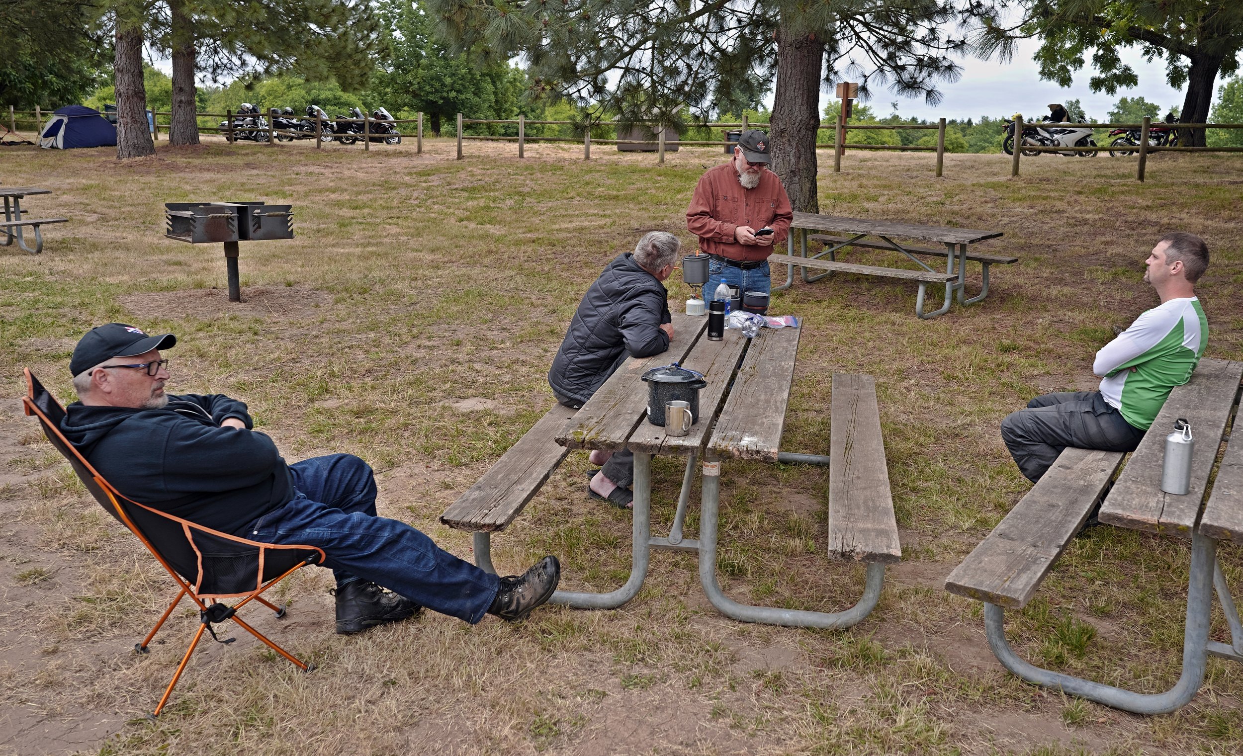 BRMC June2023 DaveJ Dave StanC BuckW relaxing in camp.jpg