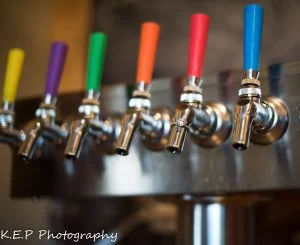 color coded taps facilitate the beer ordering system at Brewability, photo via K.E.P. Photography