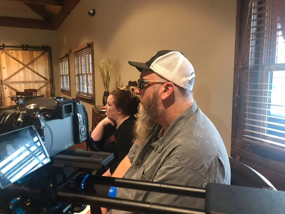 Steve Akley and Autumn Nethery look on as Joyce Nethery of Jeptha Creed is being interviewed for the film
