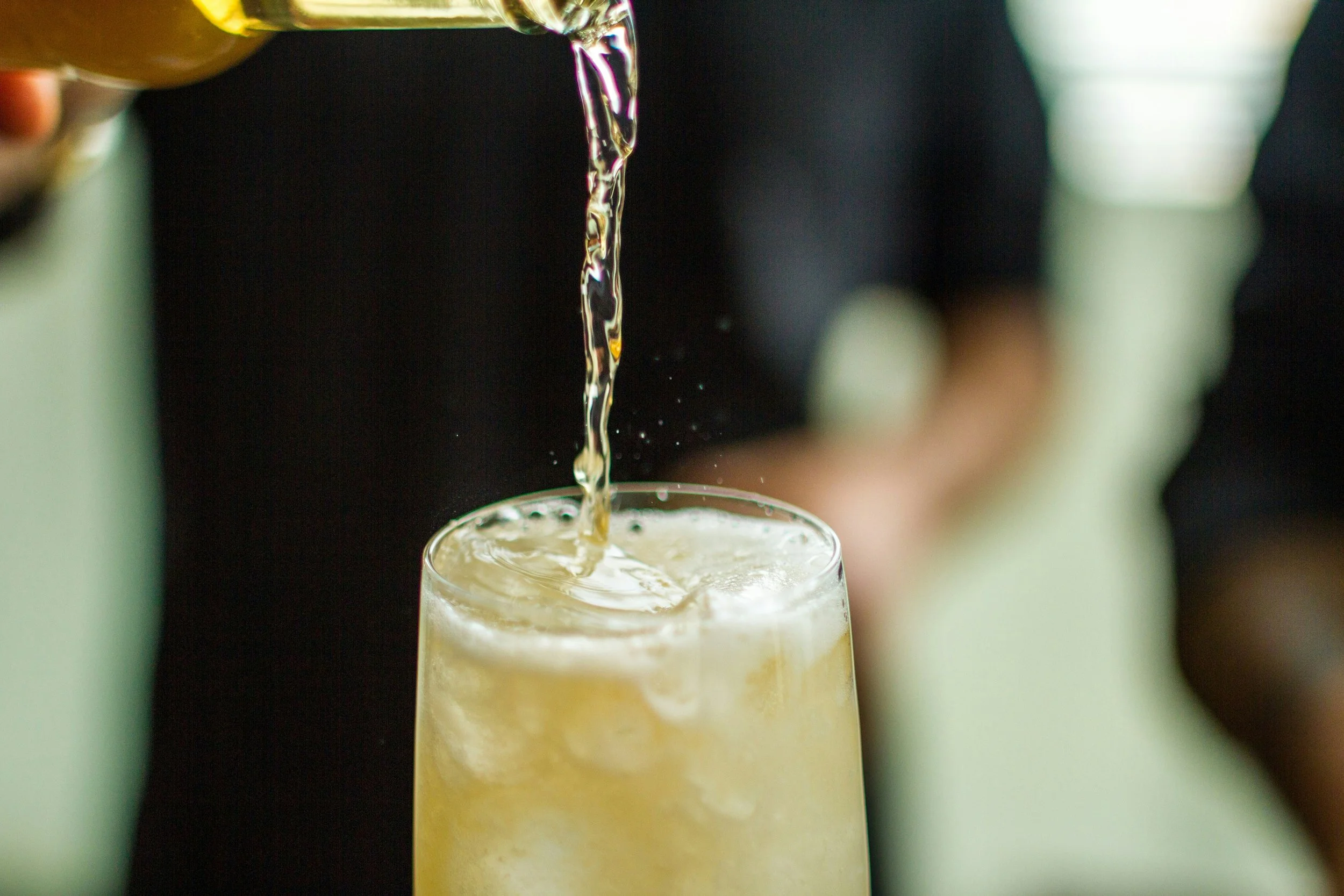 Pouring sake in cocktail