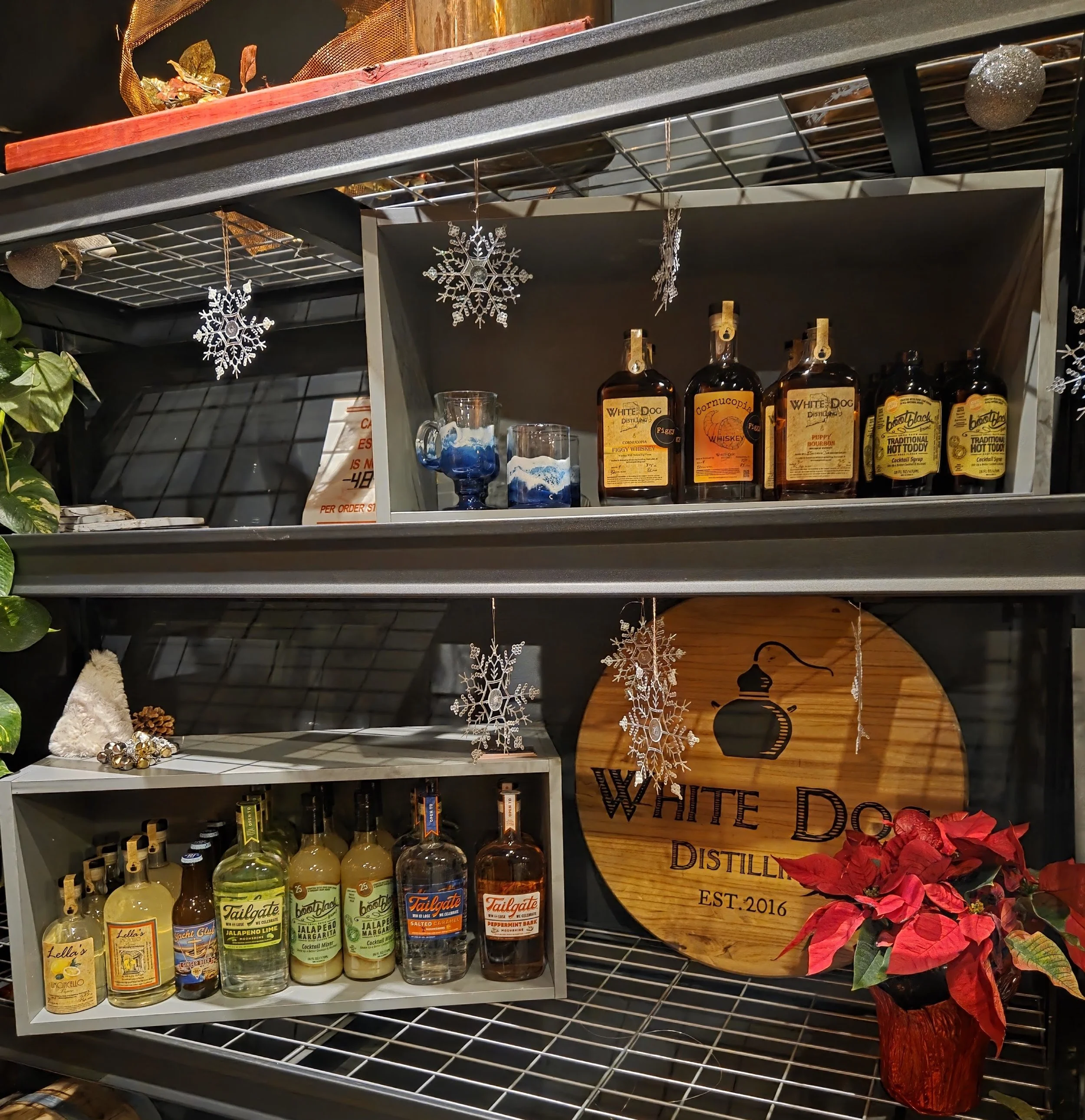 A festive shelf of spirits at White Dog Distilling