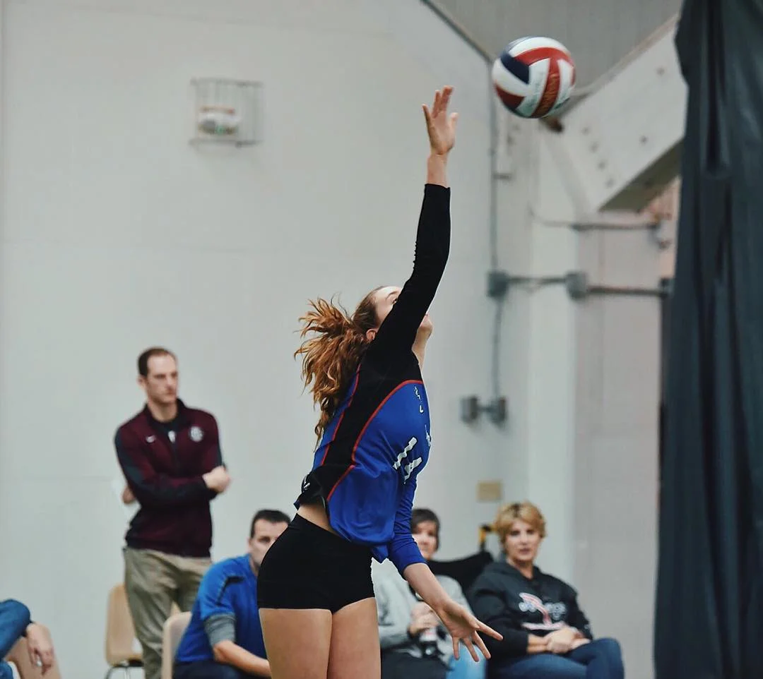 Francesca M. ('18) impressively spikes the ball across the court, leading her team to a triumphant win.