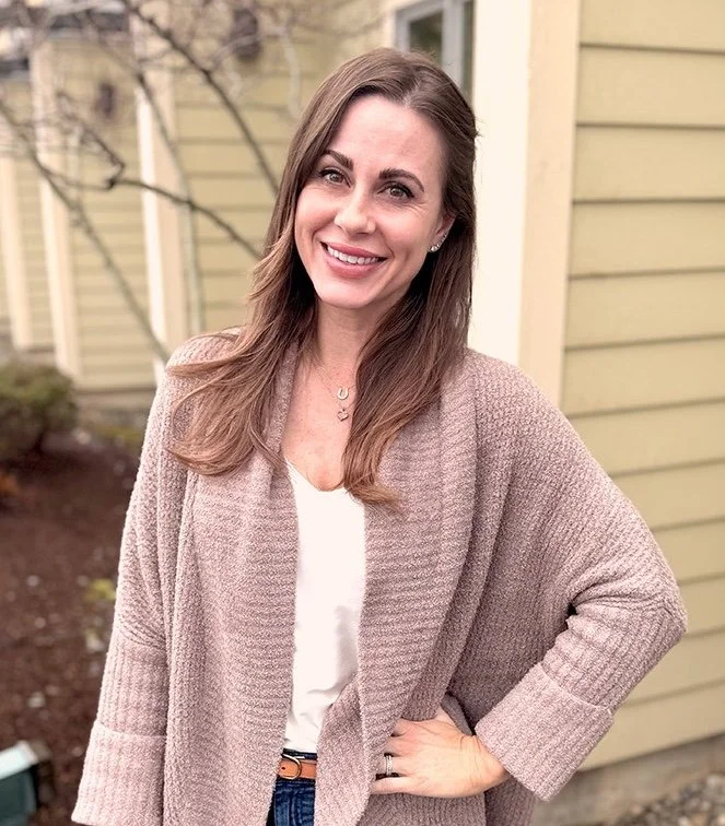lady smiling with sweater and brown hair